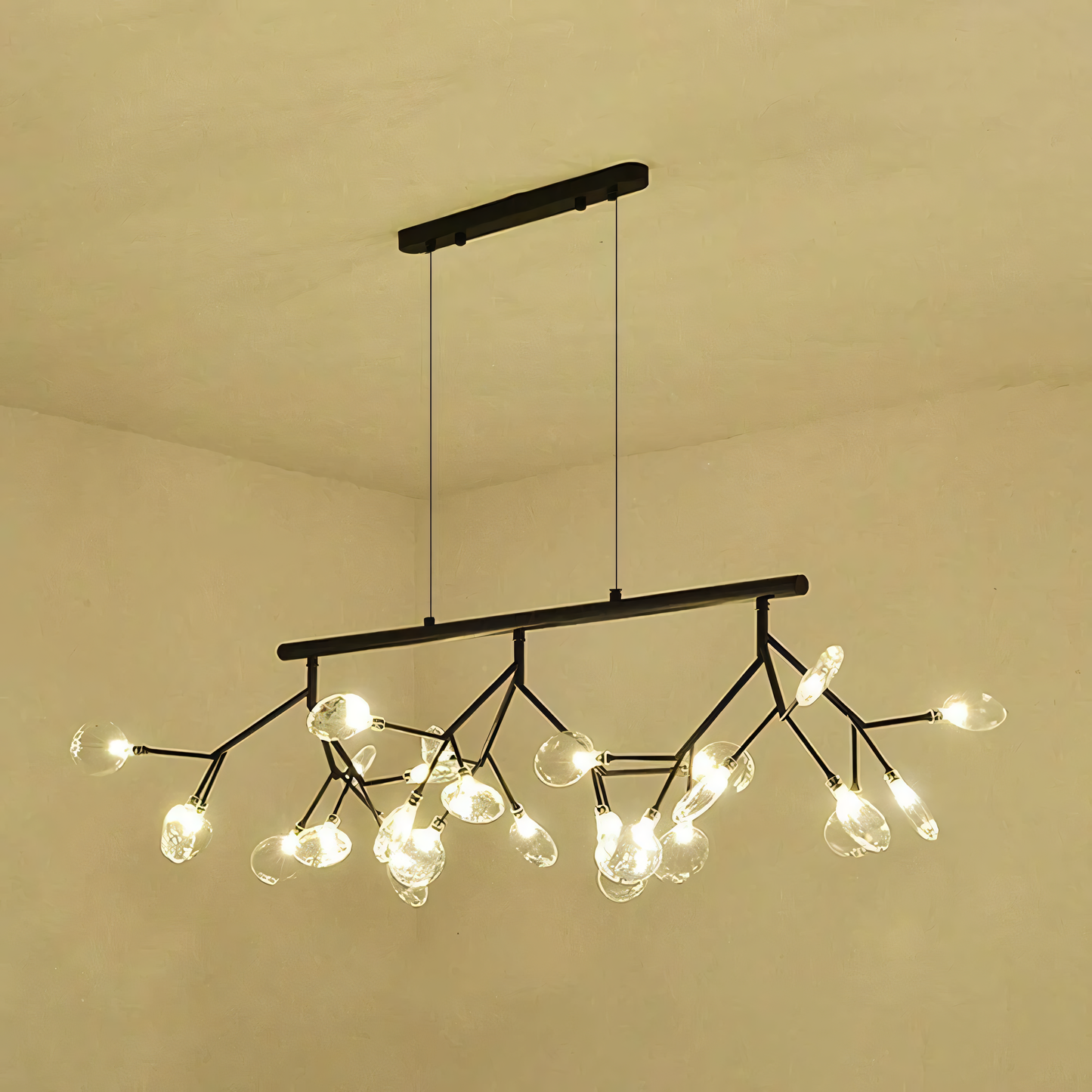 A close-up of the Blaze Modern Dining Chandelier reveals the intricate details of the black metal frame and the rods with LED tips.