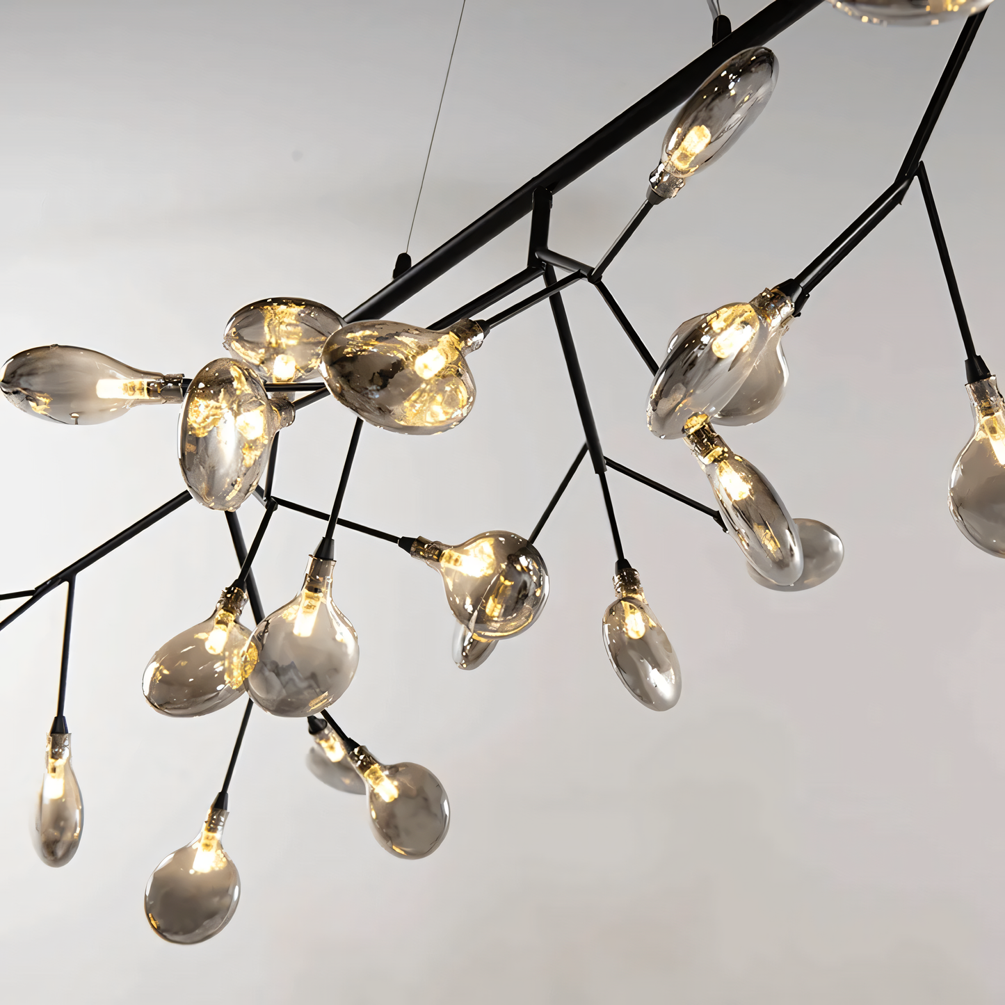 The Blaze Modern Dining Chandelier adds a touch of whimsy and elegance to a dining room table setting.