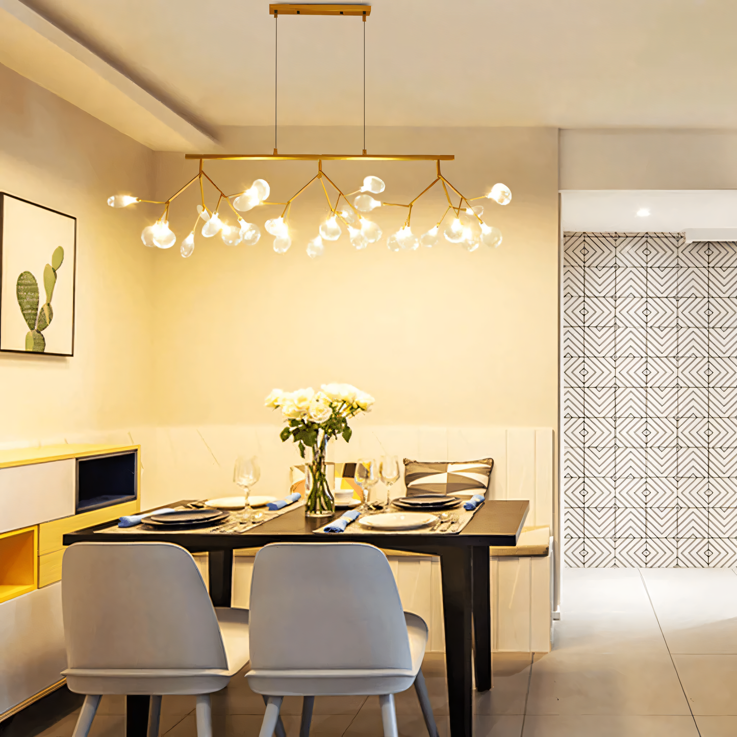 A black, circular chandelier with rods tipped with LED bulbs hangs from a dining room ceiling. The chandelier casts a warm, inviting glow on the space.