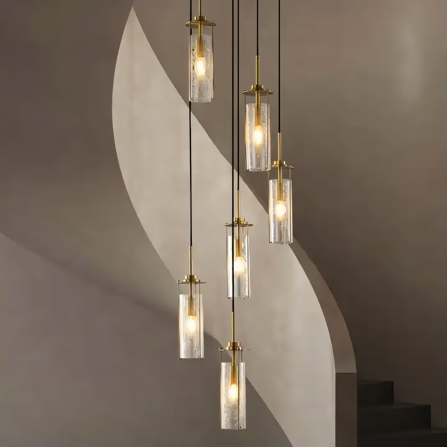 A close-up of the 6 Light Brass Gold Crackle Glass Double Height Stair Chandelier reveals the intricate details of the gold finish and the unique texture of the crackle glass globes.