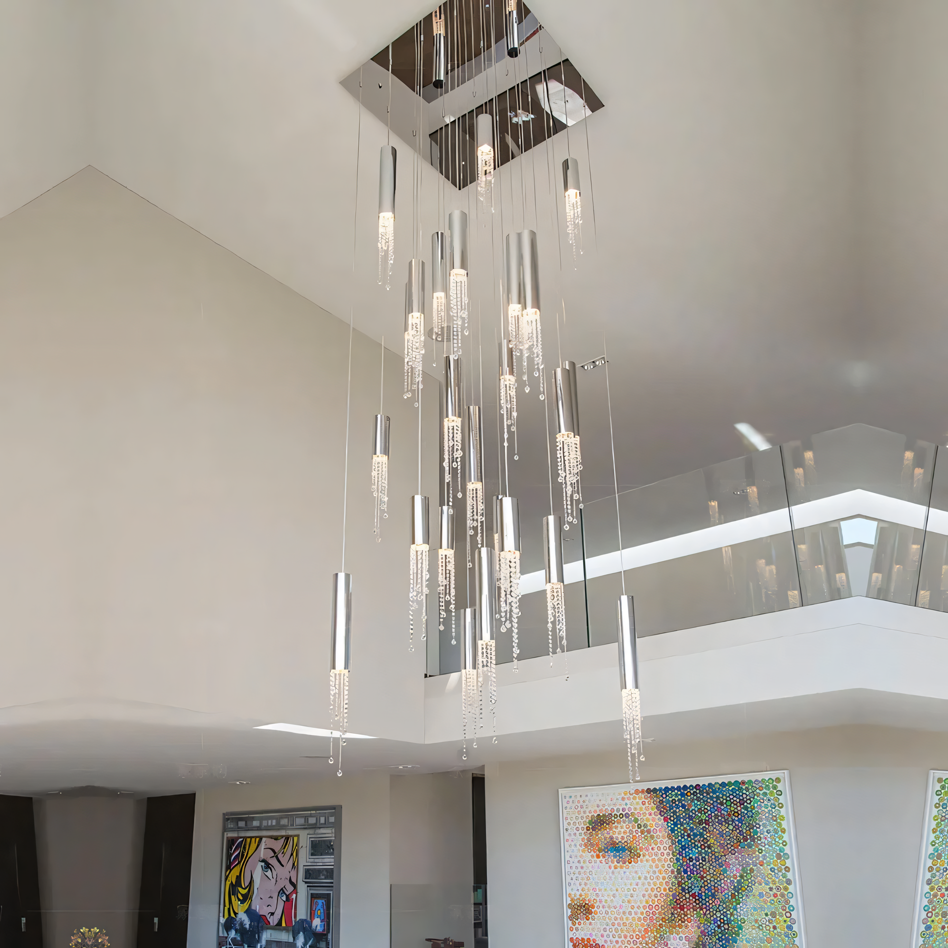 The Zooid Pendant Chandelier illuminates a modern office space with a warm and inviting glow.