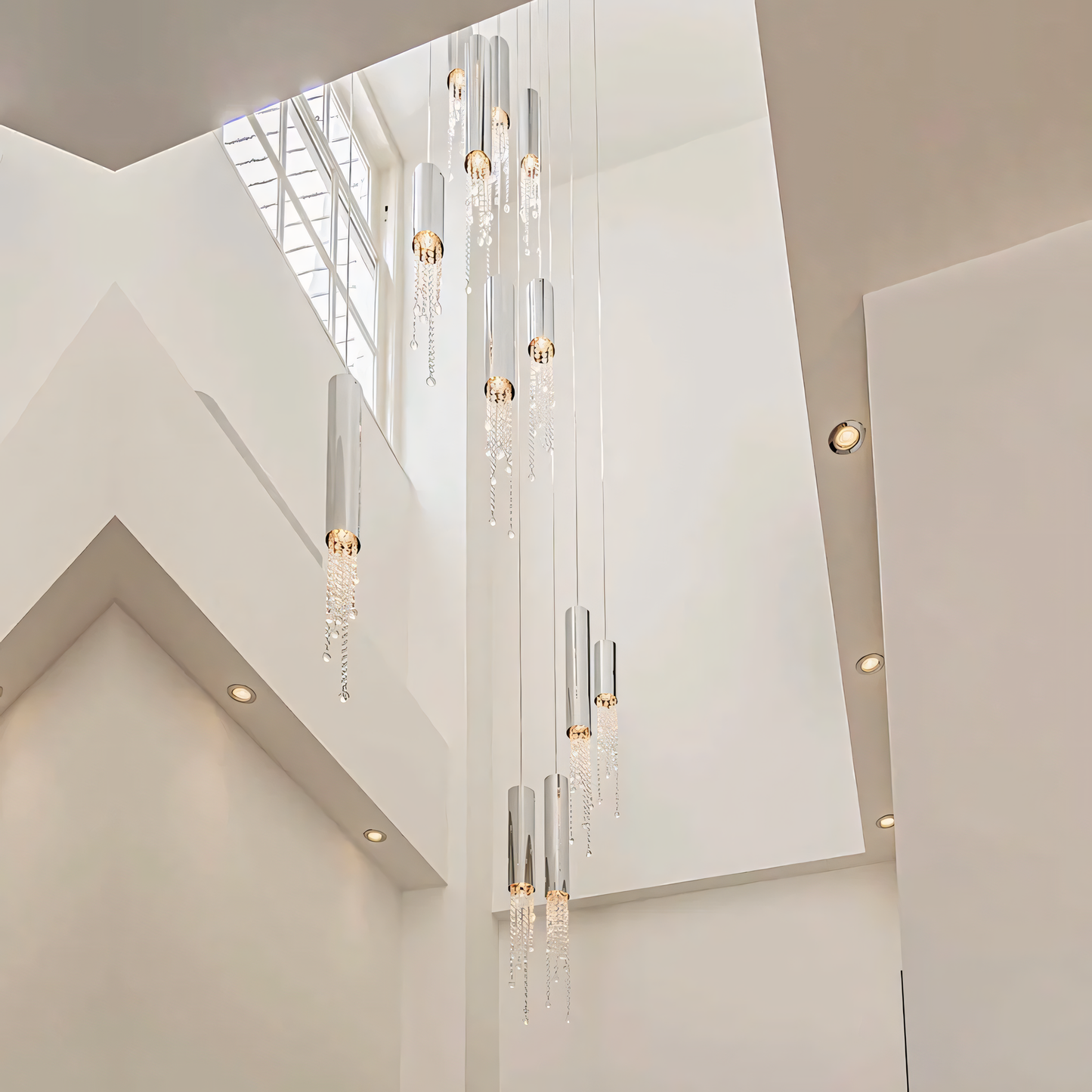 The Zooid Pendant Chandelier, a stunning centerpiece, hangs above a dining table.