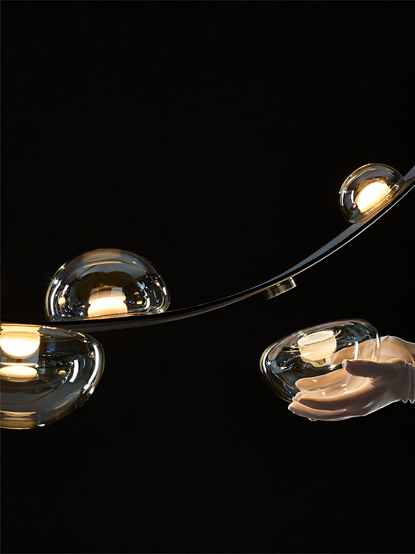 A sleek black chandelier with a black leather belt suspends seven smoky glass globes, creating a captivating display of light and shadow.