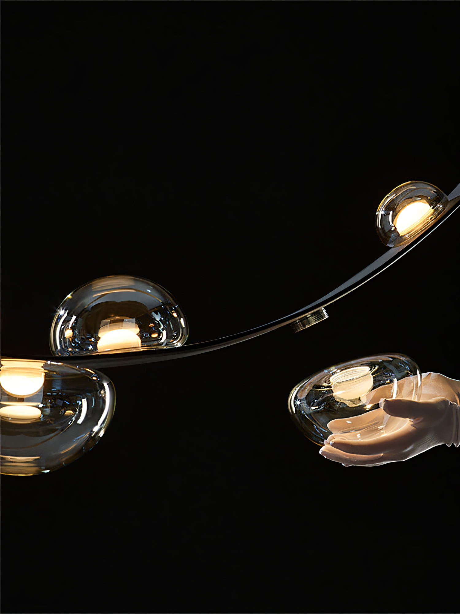 A sleek black chandelier with a black leather belt suspends seven smoky glass globes, creating a captivating display of light and shadow.