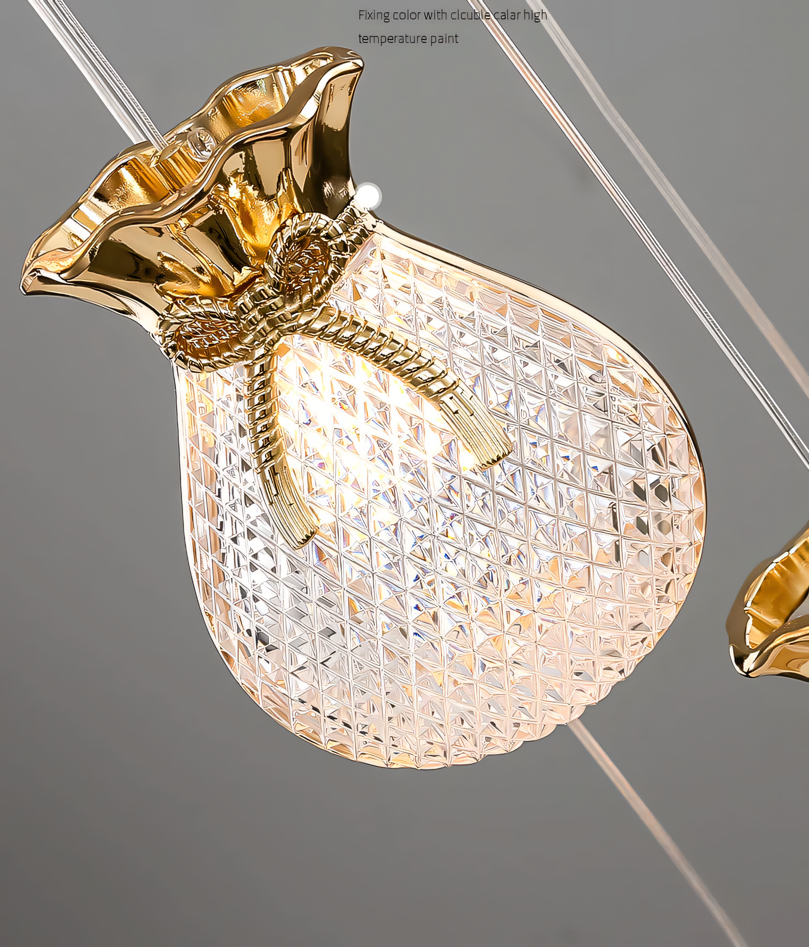 Elegant brass and crystal 6-light LED chandelier cascading down a tall staircase in a modern, luxury home interior