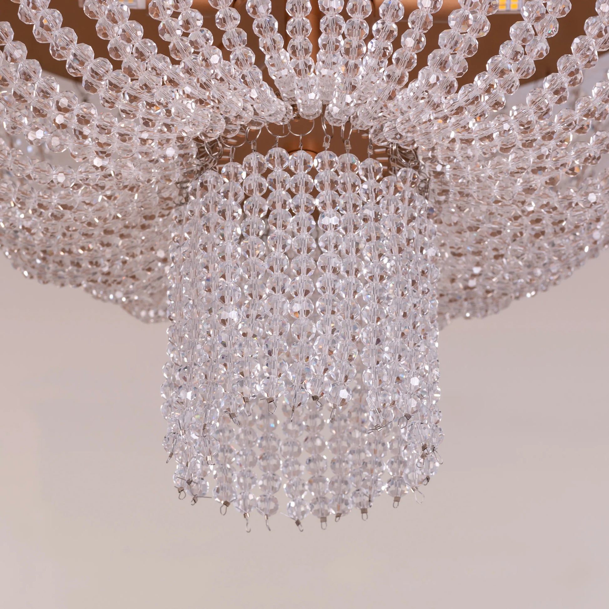 Warm Embrace Gold Crystal Ceiling Light featuring a golden framework adorned with multifaceted crystals, designed to create a luxurious and comforting warm glow in elegant spaces.