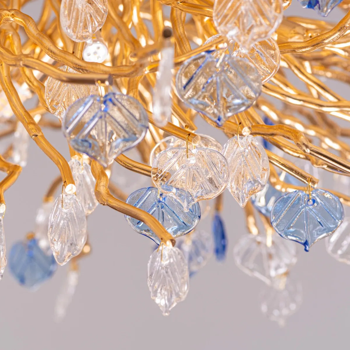 Yacht Life Gold Crystal Ceiling Light illuminating an elegant living room with a warm, luxurious glow