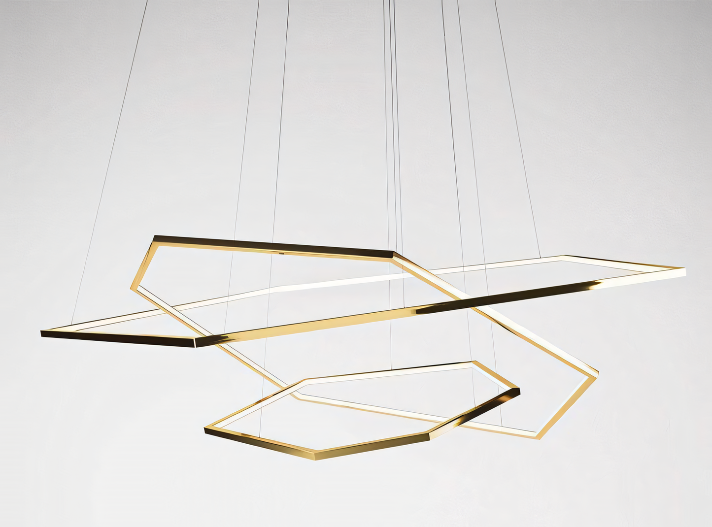 Warm LED lighting from hexagonal gold ring chandelier