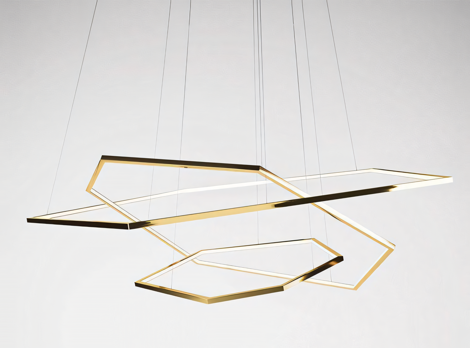 Warm LED lighting from hexagonal gold ring chandelier