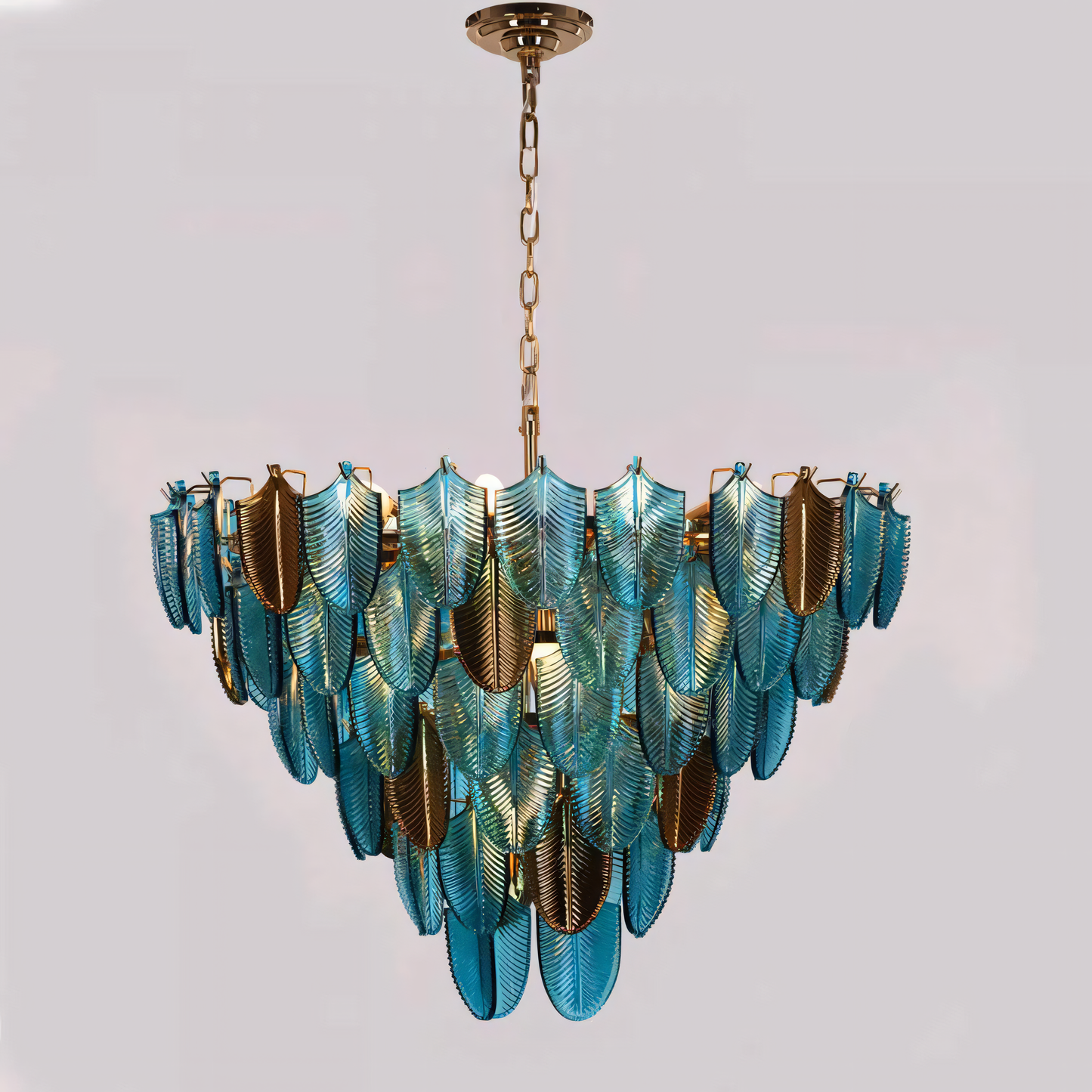 The Gratus Luxe Modern Glass Leaf Chandelier mimics the look of a porthole window, inviting you to gaze upon a captivating spectacle of light.