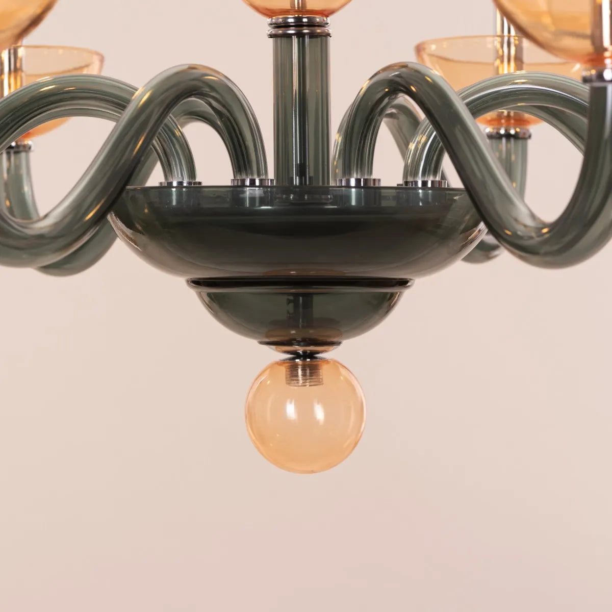 Large "Steps Of Rome" chandelier with tiered green and amber glass elements, dramatically illuminated in a spacious, elegant room.