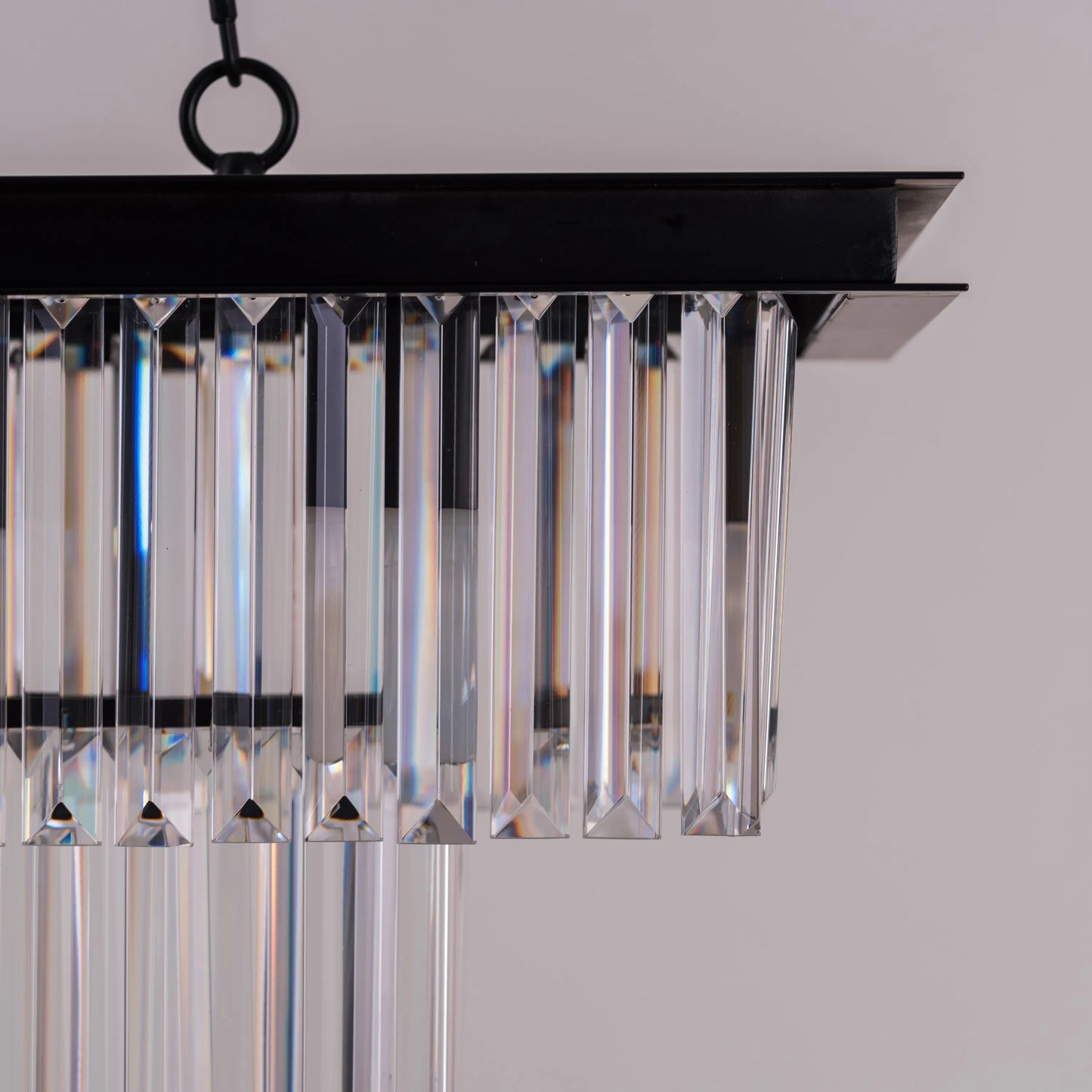 Trust Fund Baby crystal chandelier hanging in a luxurious grand foyer.