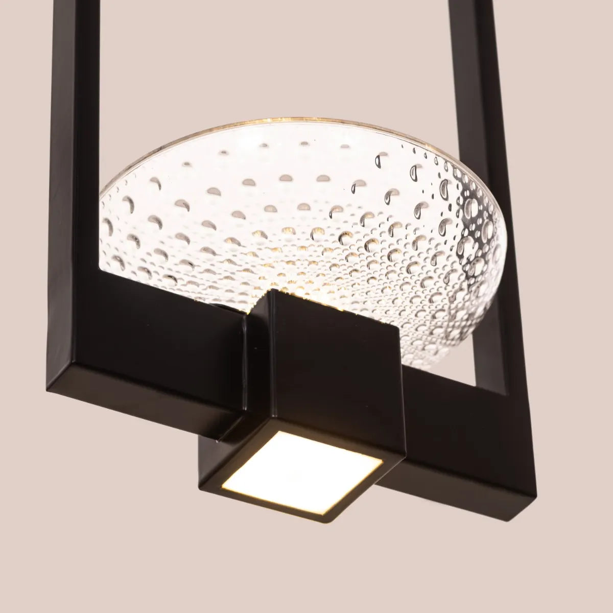 Adding Up Chandelier with sleek black and gold design illuminating a modern living room.