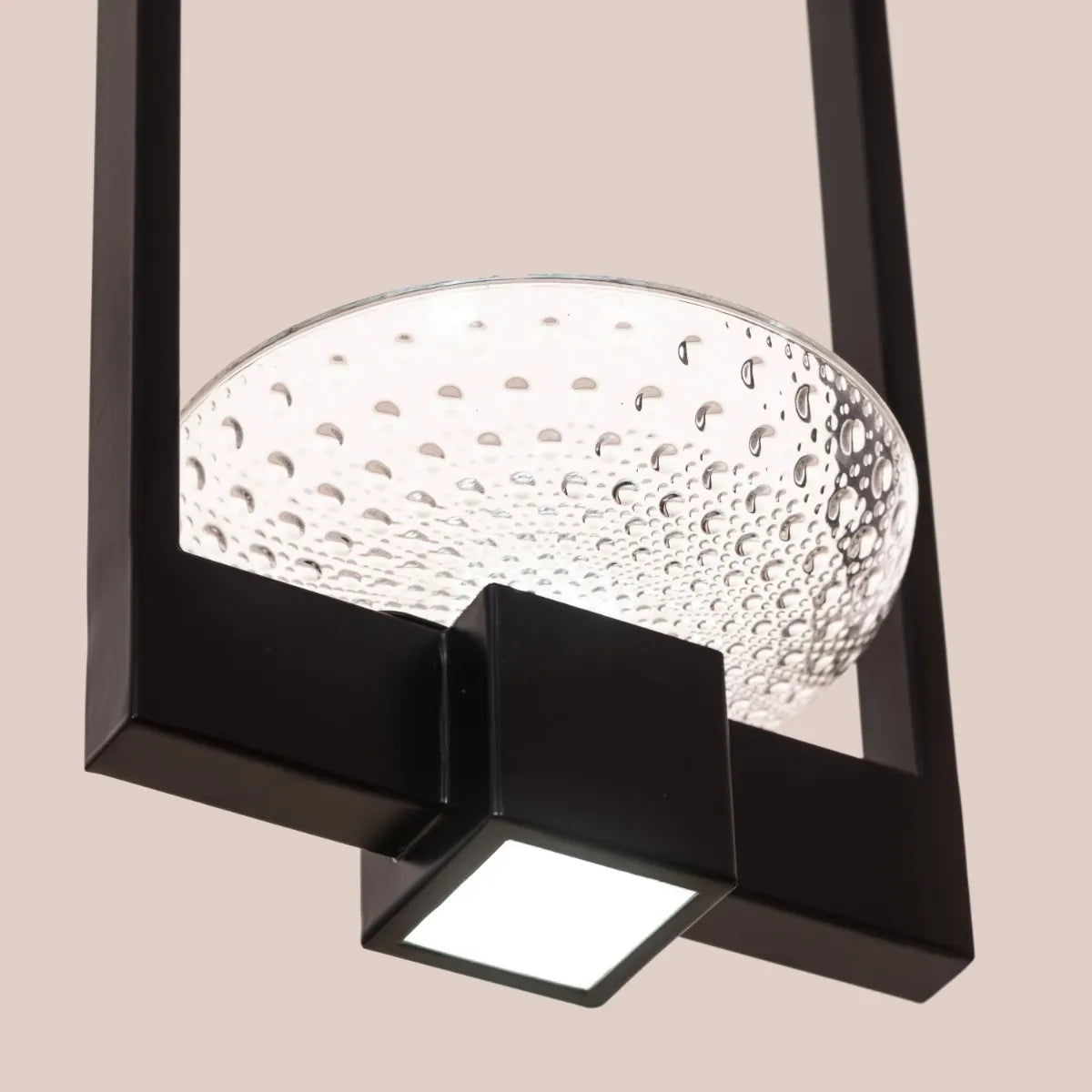 Adding Up Chandelier with sleek black and gold design illuminating a modern living room.
