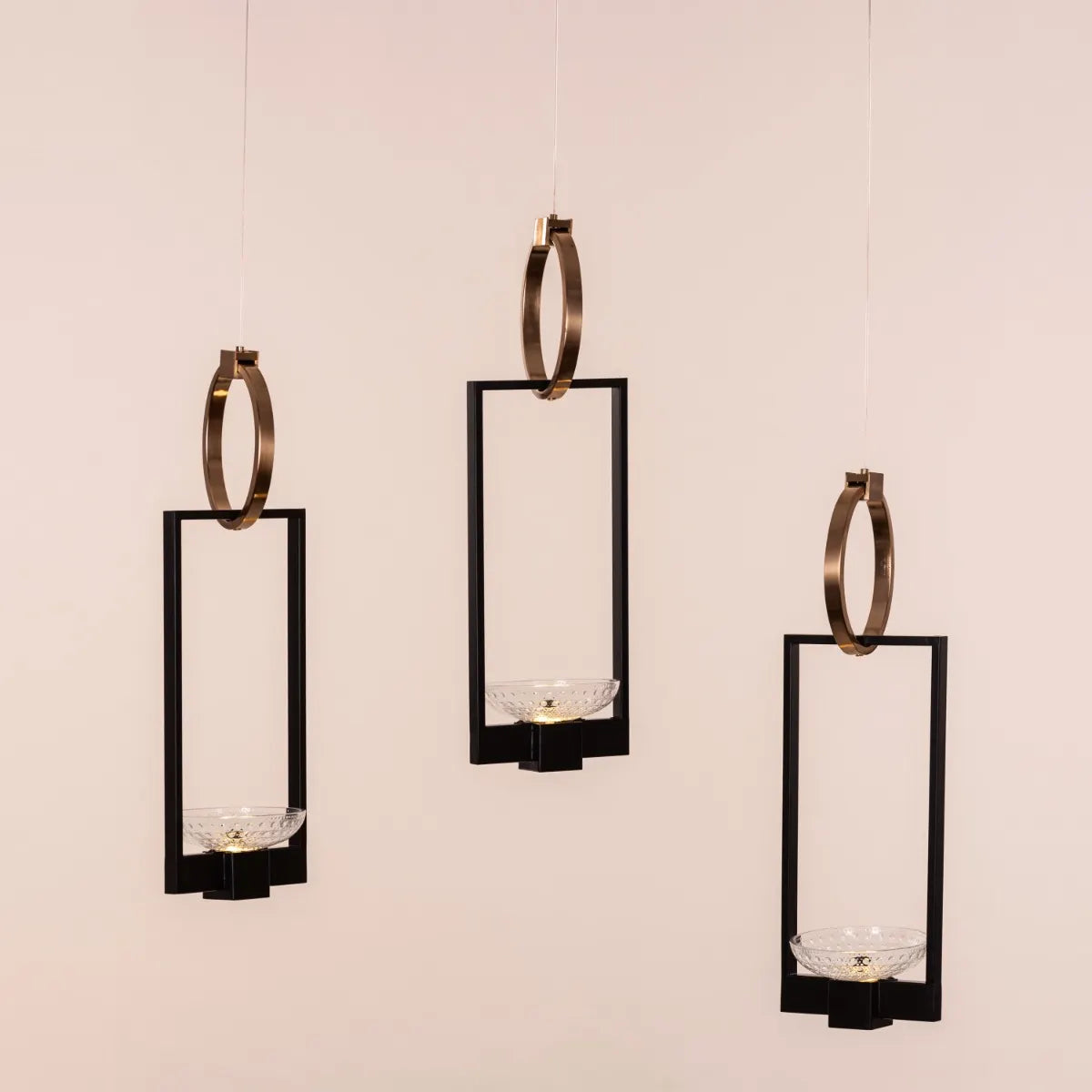 Adding Up Chandelier with sleek black and gold design illuminating a modern living room.