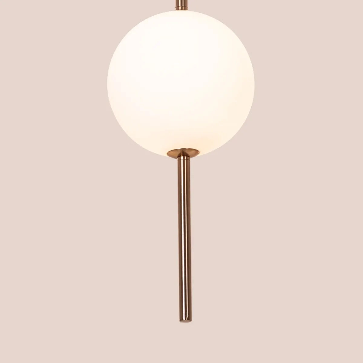 A modern pendant light named 'Peacemaker,' featuring a sleek gold finish and built-in LED lighting. The minimalist design showcases clean lines and a refined silhouette, while the integrated LED provides bright, energy-efficient illumination. This elegant pendant adds a touch of sophistication and warmth to any space, making it a perfect addition to contemporary decor