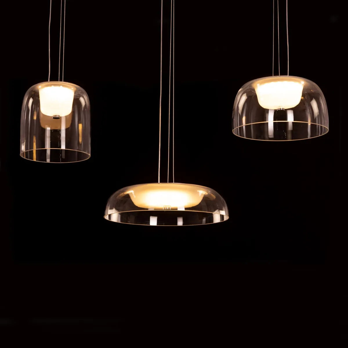 Love Spell Glass Chandelier casting a romantic glow in an elegant dining room.