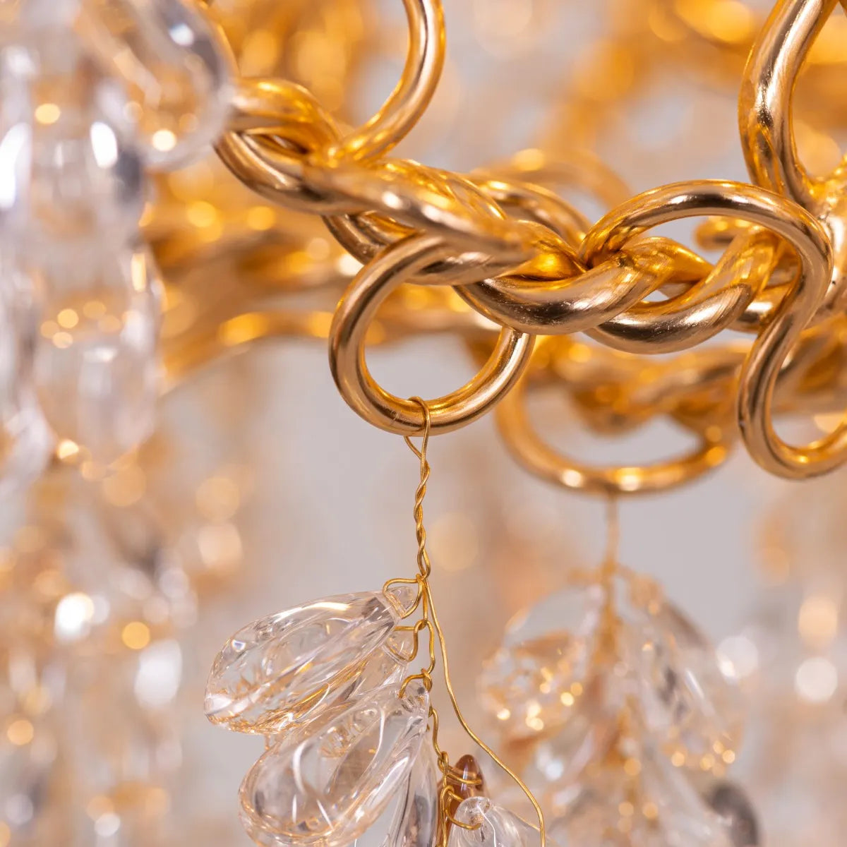 Believe In Magic large gold crystal chandelier illuminating an elegant living room