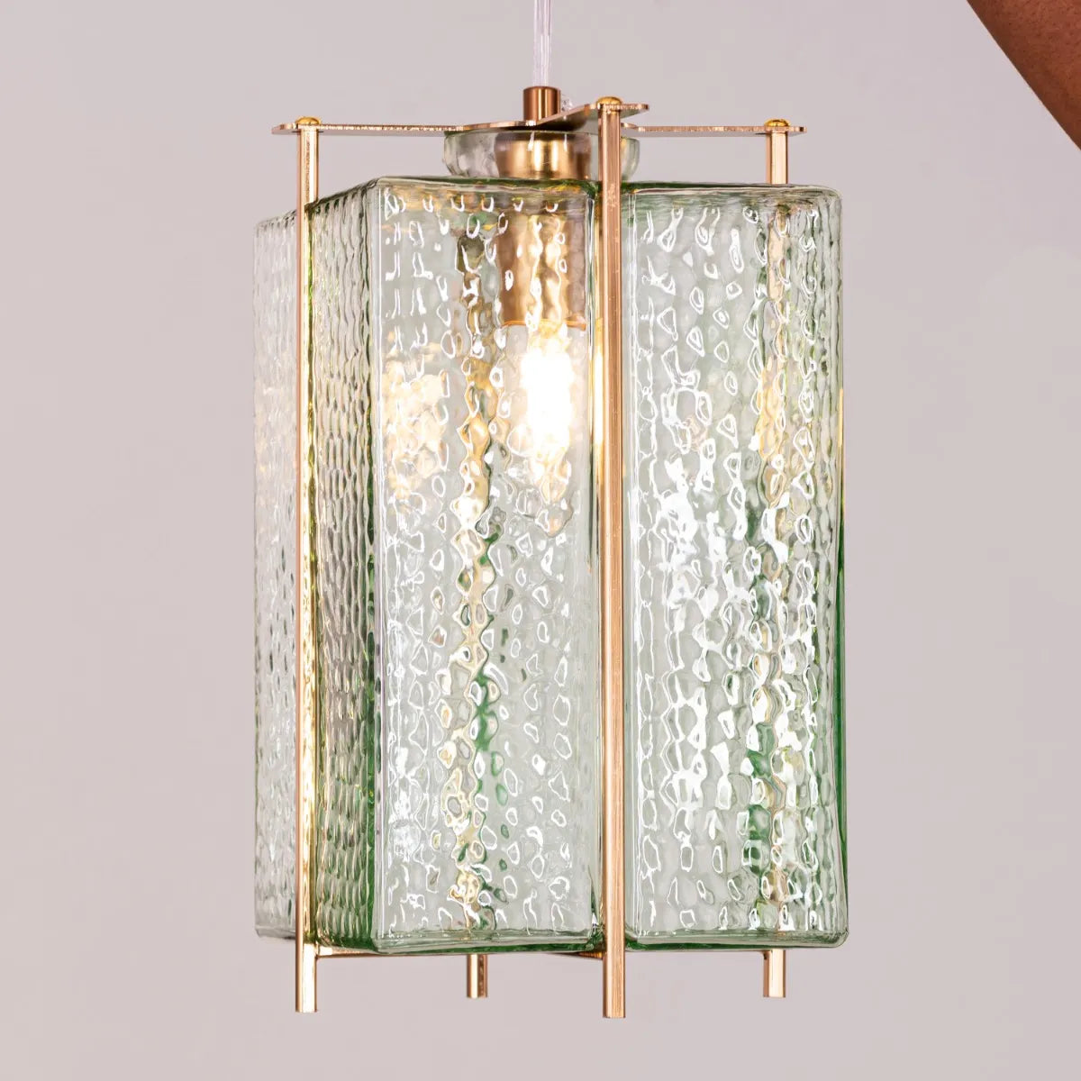 Take The Leap Textured Glass Chandelier illuminating a modern living room.
