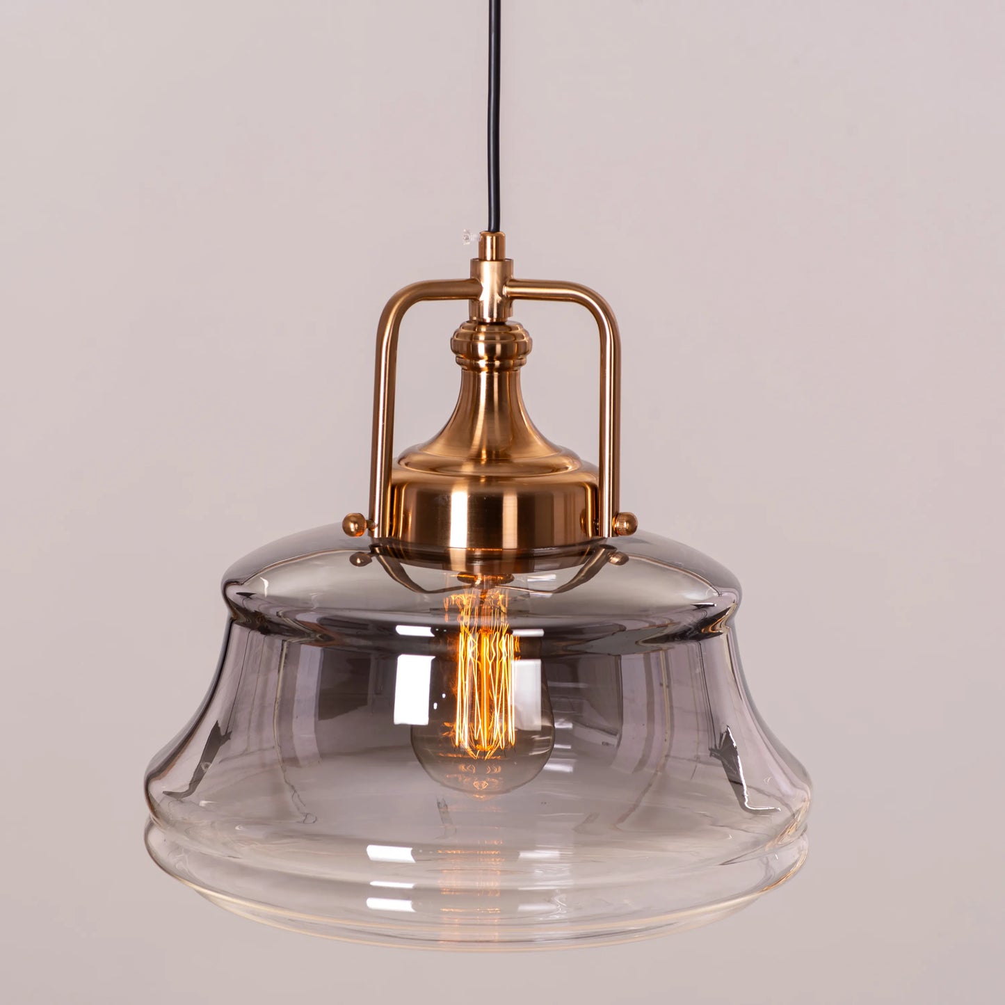 Stylish Eyes Closed Clear Glass Pendant Light Combining Gold and Smokey Grey for a Unique Look