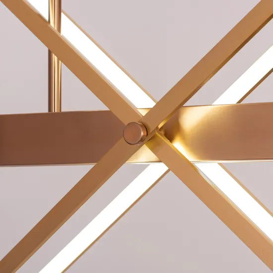 Large gold Pack Your Bags chandelier with dimmable LED lights illuminating a grand foyer