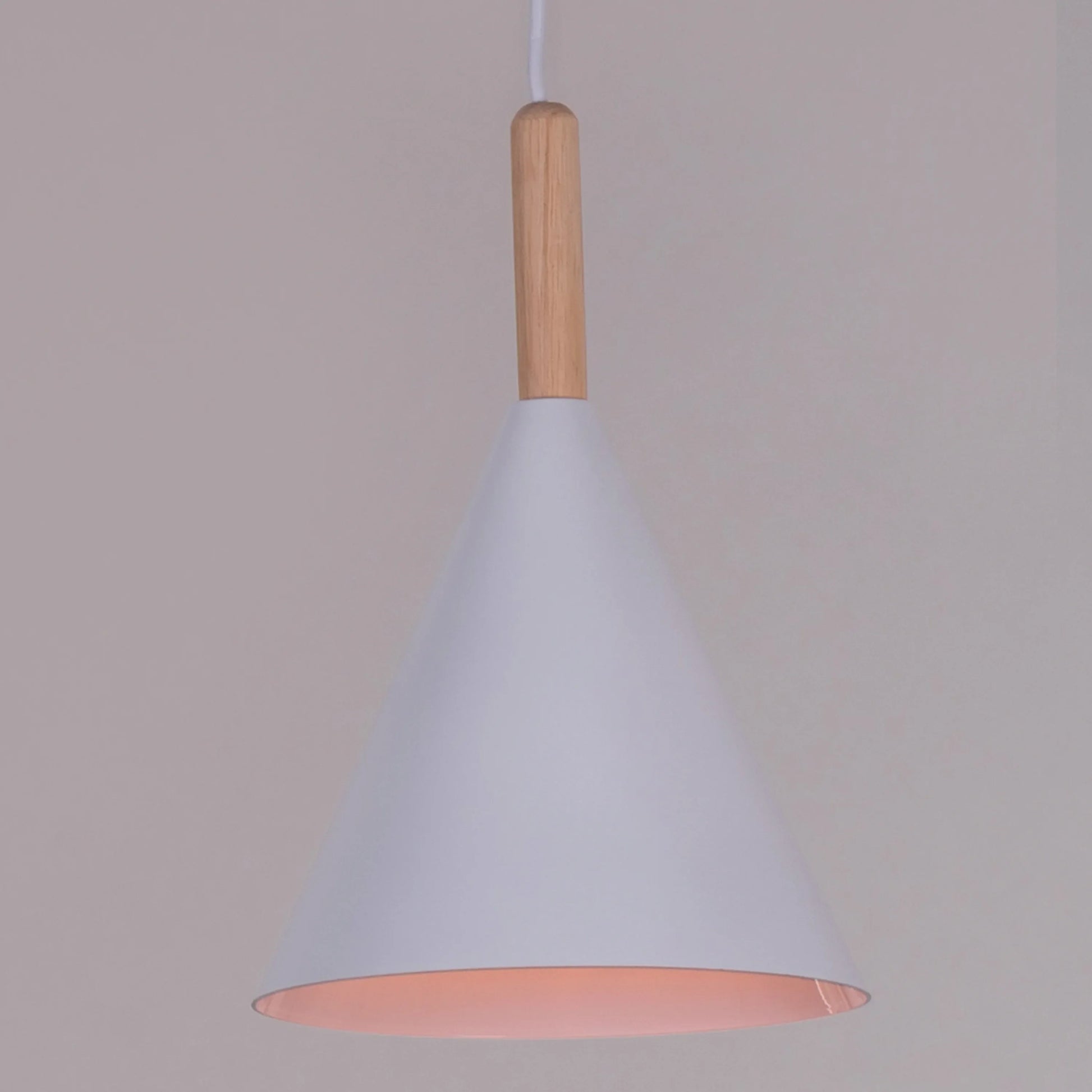A vibrant pendant light named 'Bonus Points,' featuring three hanging heads in a playful combination of blue, green, and white. Each pendant has a smooth, minimalist design with sleek curves, creating a modern and cheerful aesthetic. The multi-colored arrangement adds a pop of color and a fun, dynamic vibe to any room.