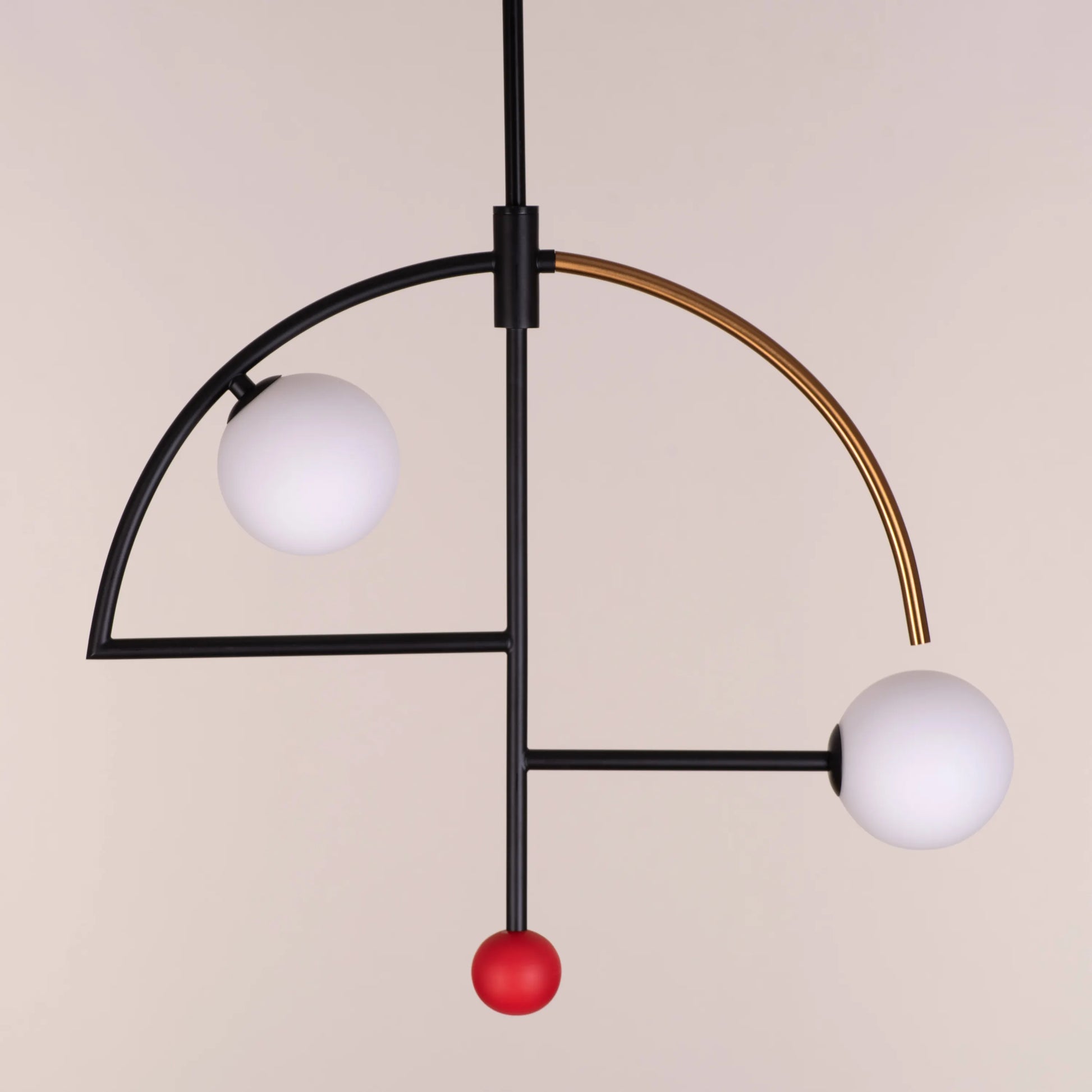 A stylish pendant light named 'Keep On Dancing' featuring a sleek black and gold design. The fixture showcases a dynamic, flowing shape, with a matte black exterior contrasted by a radiant gold interior that reflects warm light. Its modern and elegant look adds a sense of movement and sophistication to any room.