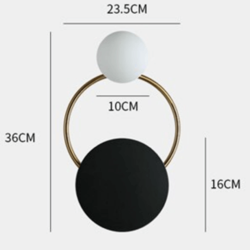 Intricate black and gold wall light, misty town's guardian.