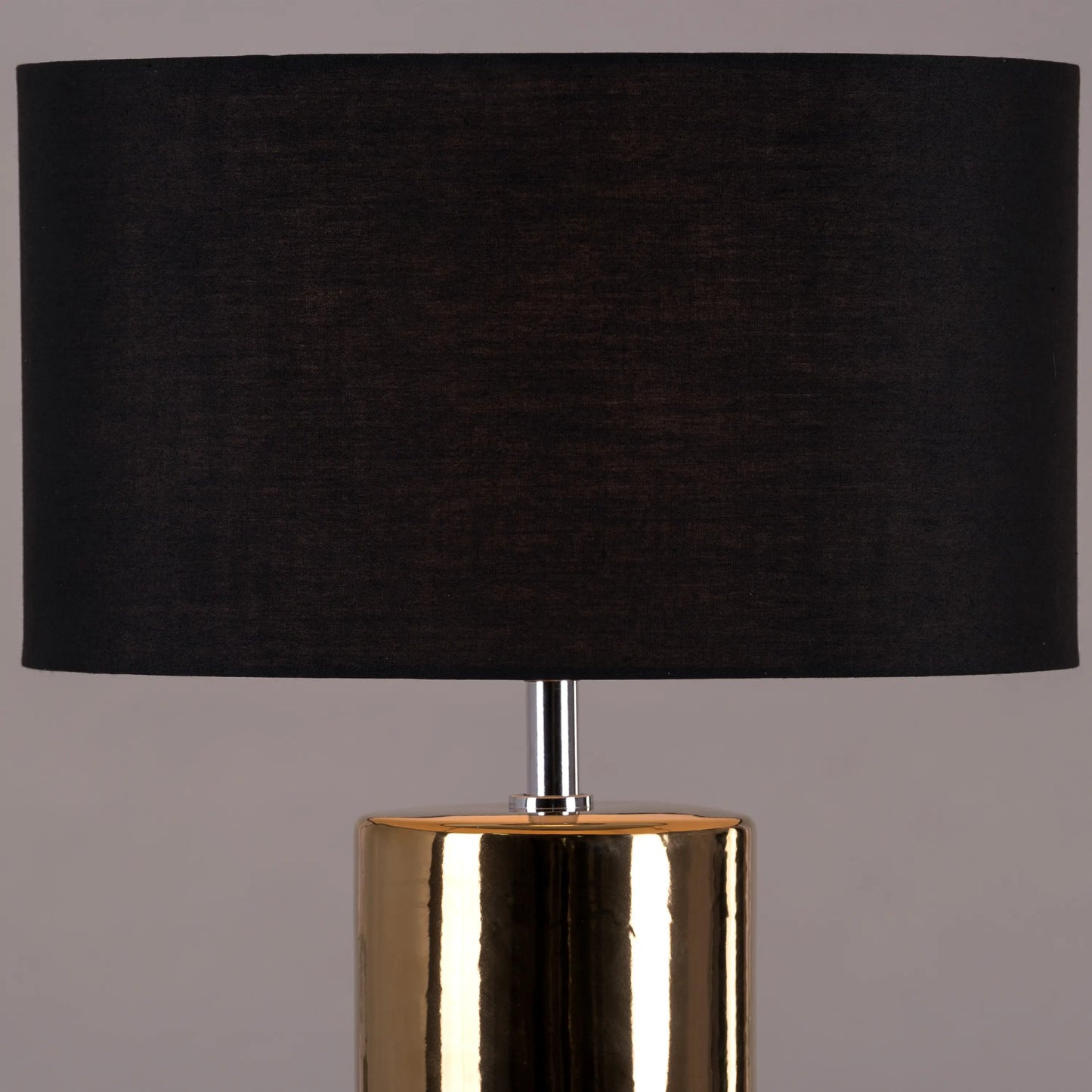 Warm and inviting ambiance from gold ceramic lamp