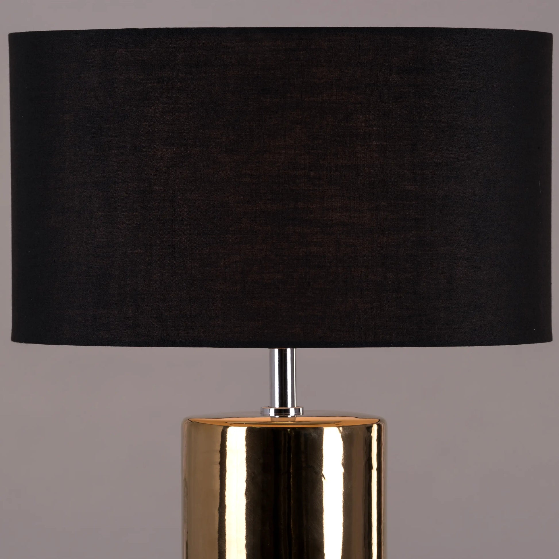 Warm and inviting ambiance from gold ceramic lamp