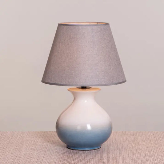 Blue and white ceramic table lamp with grey shade