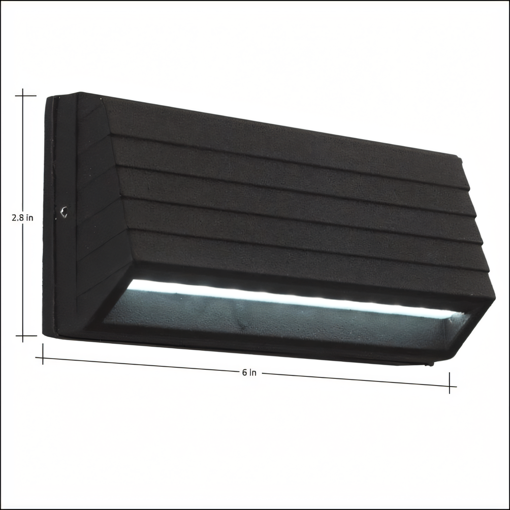 Intricate black metal wall sconce guarding secrets