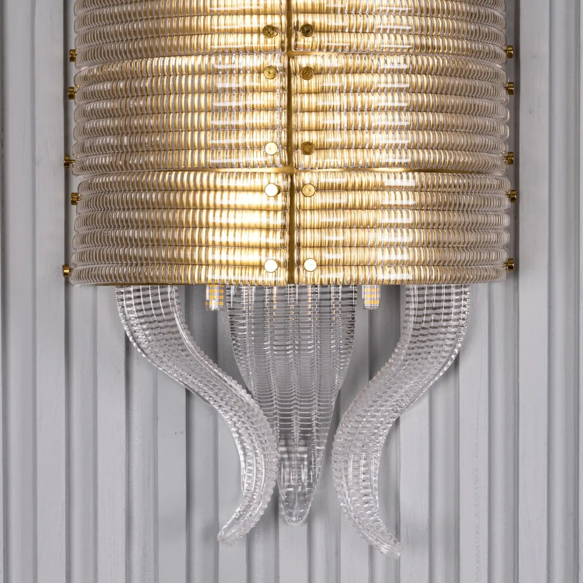 Satin Brass Wall Light Fixture - A high-quality, energy-efficient wall light with a minimalist metal frame and a captivating interplay of light and shadow.