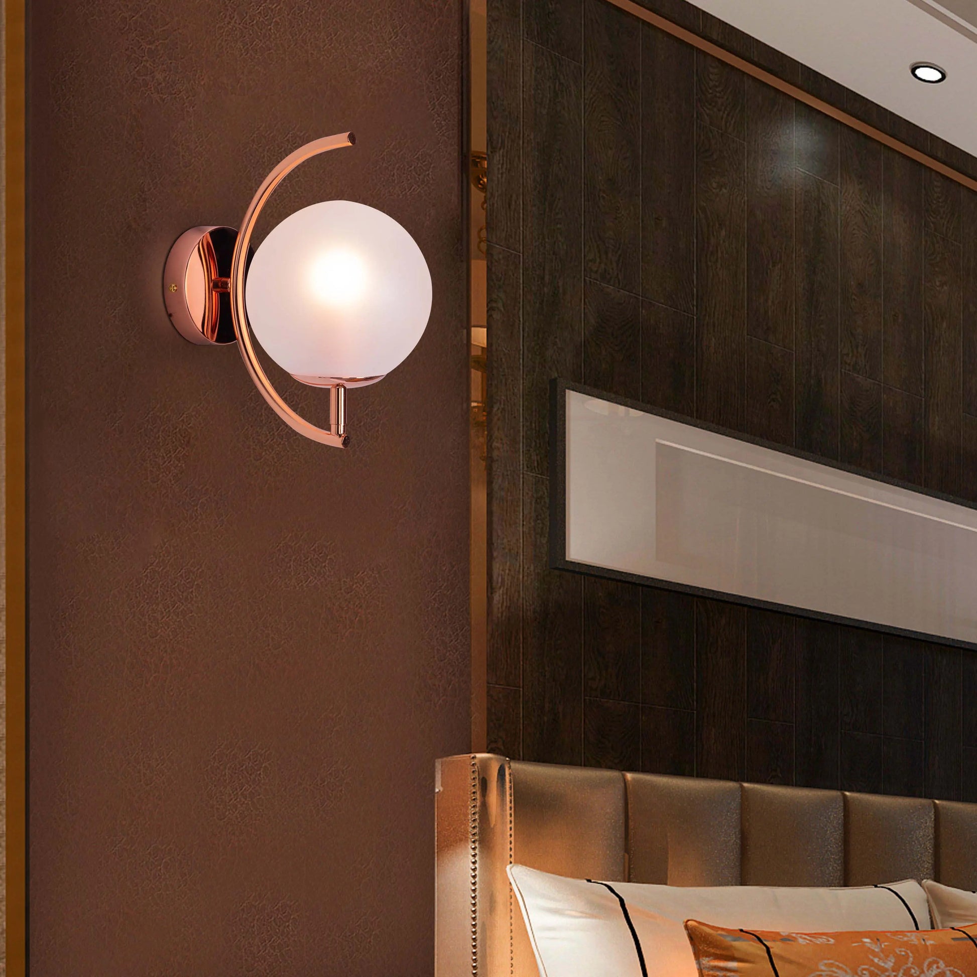 Show Me Love wall light casting a warm glow in a minimalist bedroom.