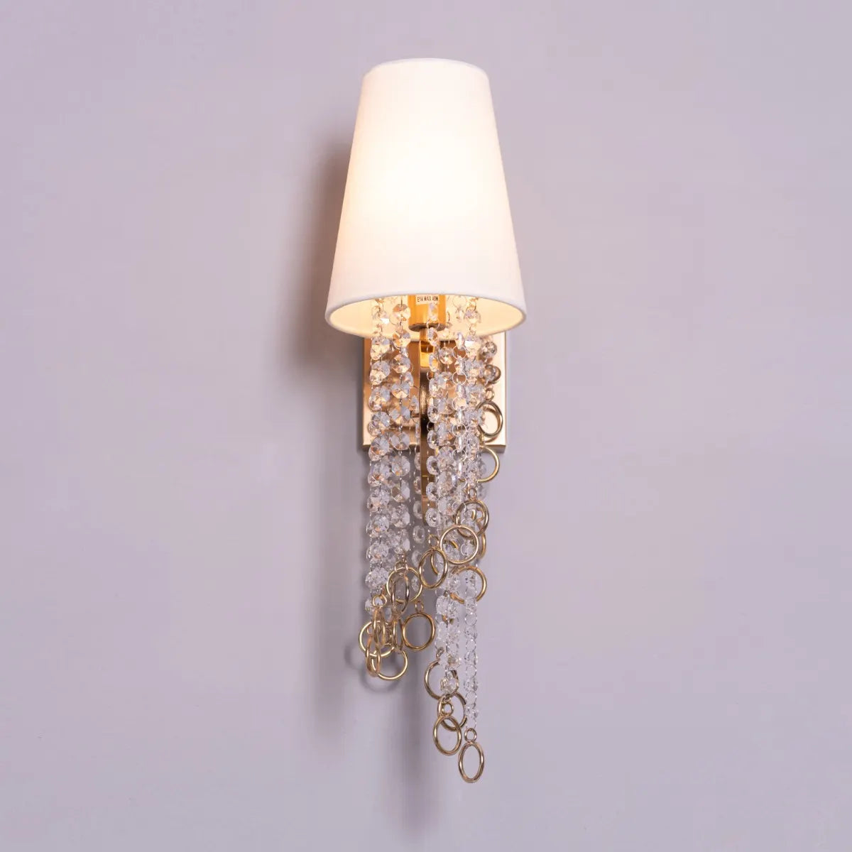 Myth & Magic Crystal Wall Light – a luxurious lighting fixture with sparkling crystals and sleek metal detailing, perfect for creating an enchanting ambiance in any space.