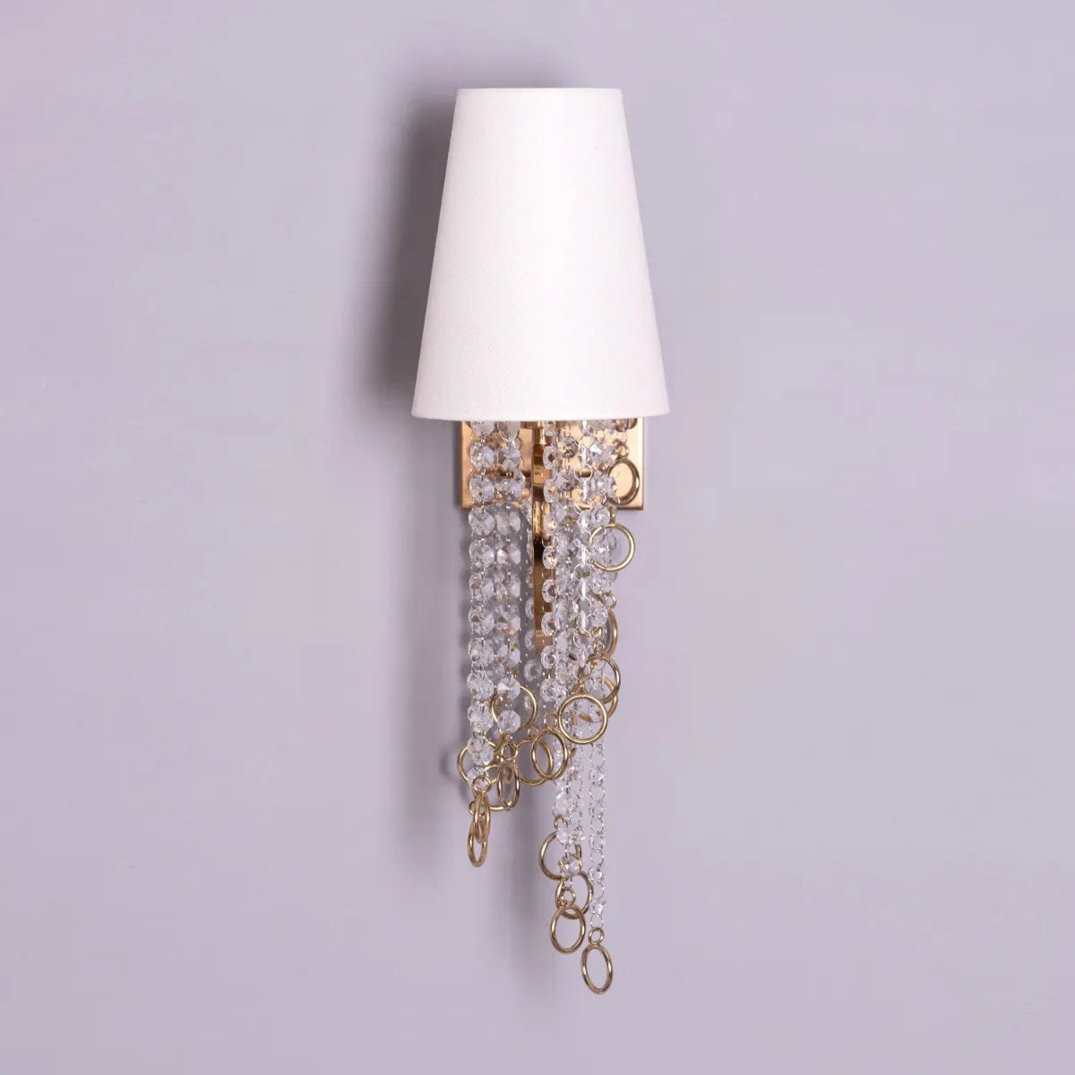 Myth & Magic Crystal Wall Light – a luxurious lighting fixture with sparkling crystals and sleek metal detailing, perfect for creating an enchanting ambiance in any space.