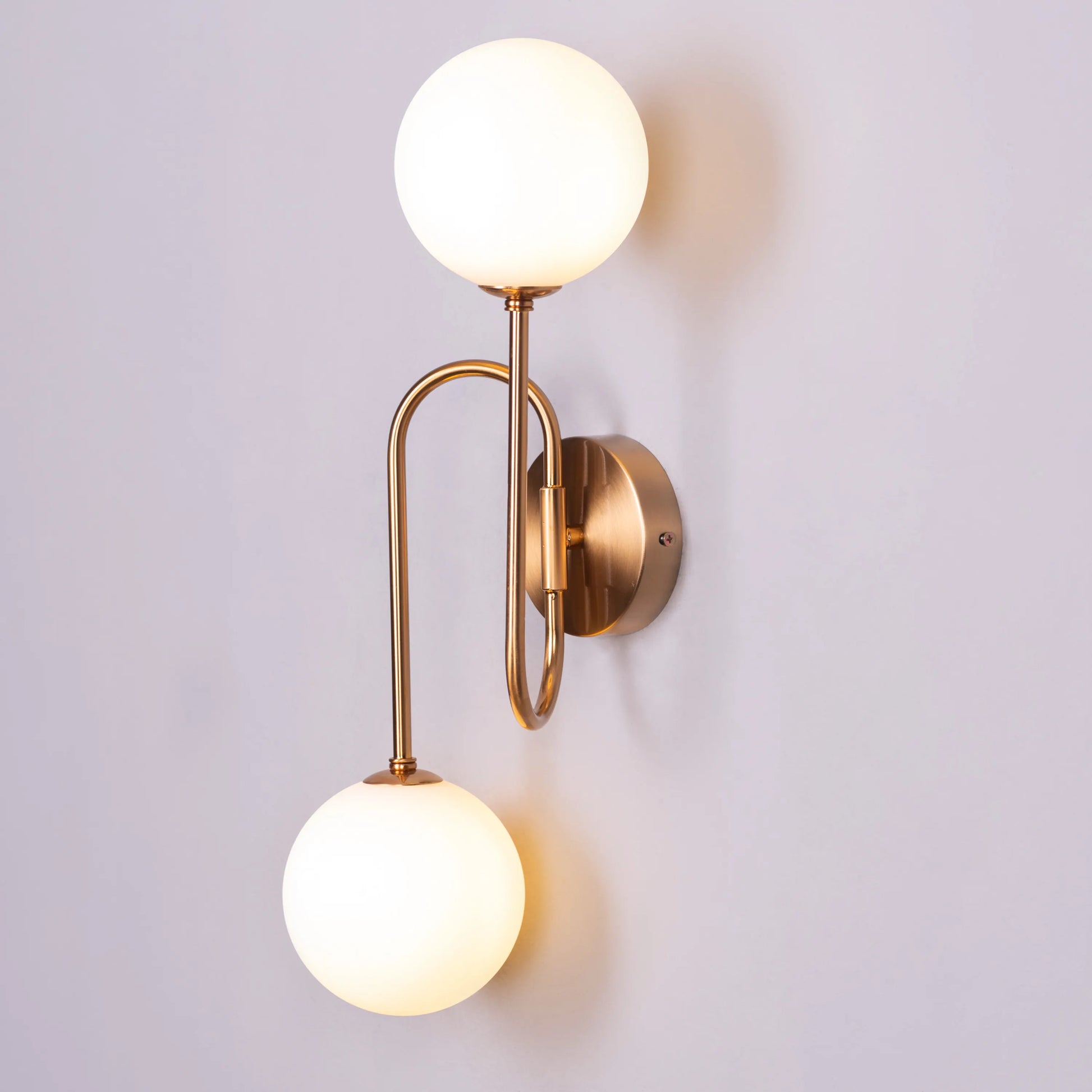 "Many Moons Away" Frosted Glass Wall Light - A sleek, modern wall sconce with a frosted glass shade that diffuses warm, glowing light.