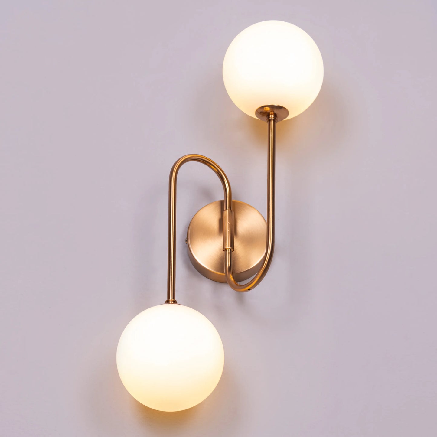 "Many Moons Away" Frosted Glass Wall Light - A sleek, modern wall sconce with a frosted glass shade that diffuses warm, glowing light.