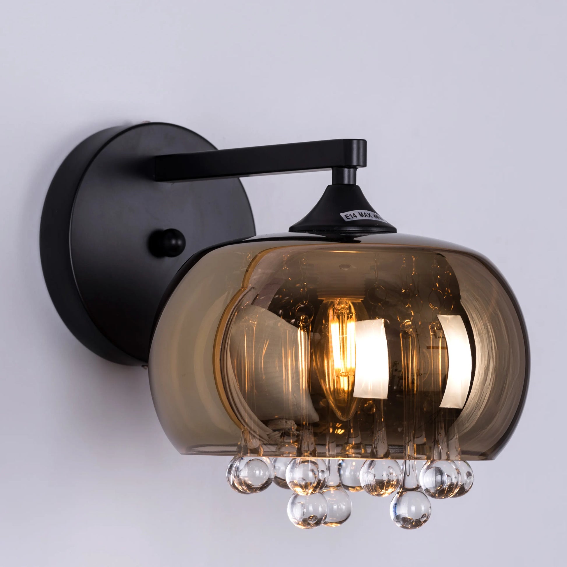 Luxurious Enchanted Crystal Wall Light featuring premium cut crystals arranged against a sophisticated black and gold framework, creating dramatic light refractions and elegant illumination patterns