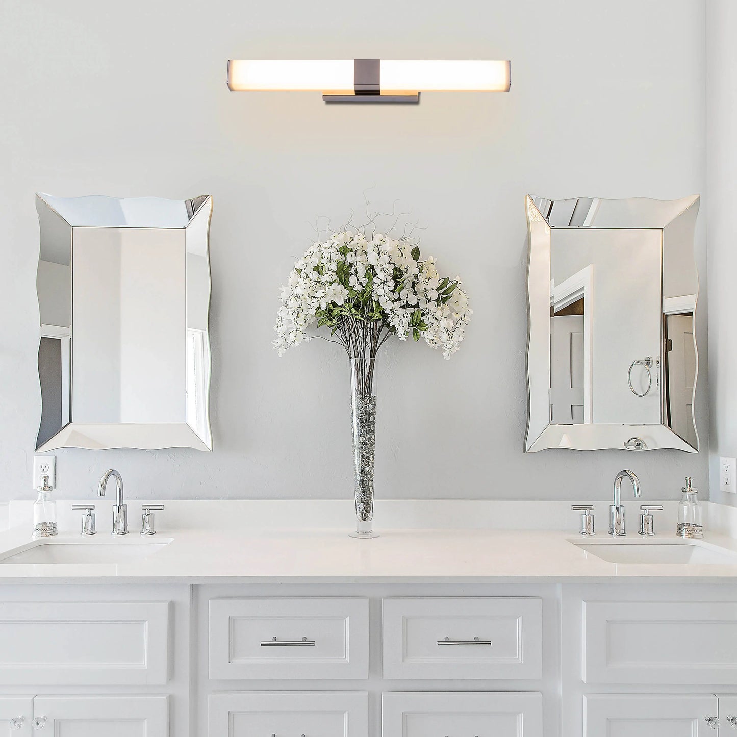 Vanity Reality Stainless Steel Vanity Light – a modern, polished stainless steel light fixture with energy-efficient LED illumination, perfect for bathrooms and dressing areas.