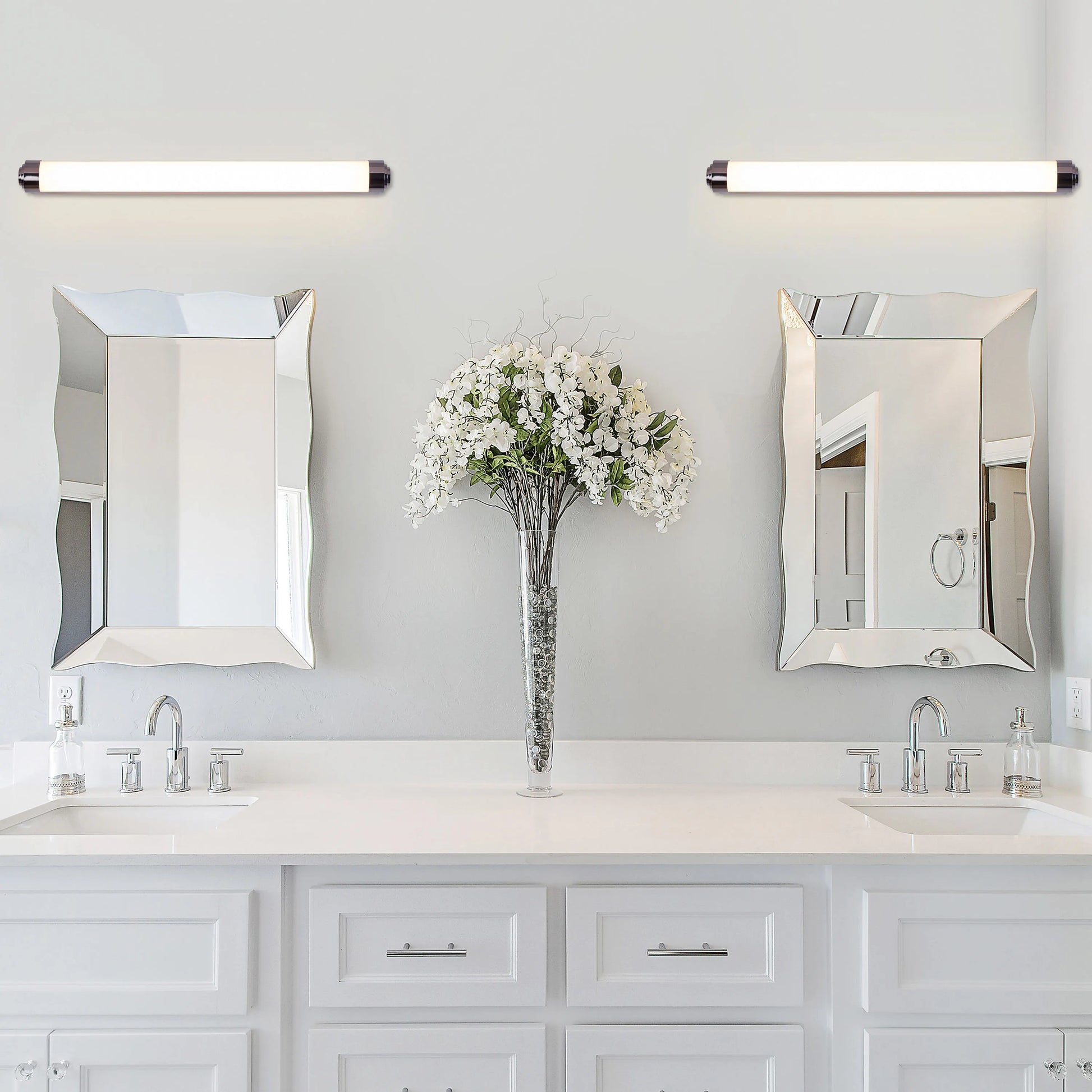 Vanity No More Stainless Steel Vanity Light – Modern stainless steel design with clear glass shades and energy-efficient LED lighting, perfect for bathroom or vanity spaces.