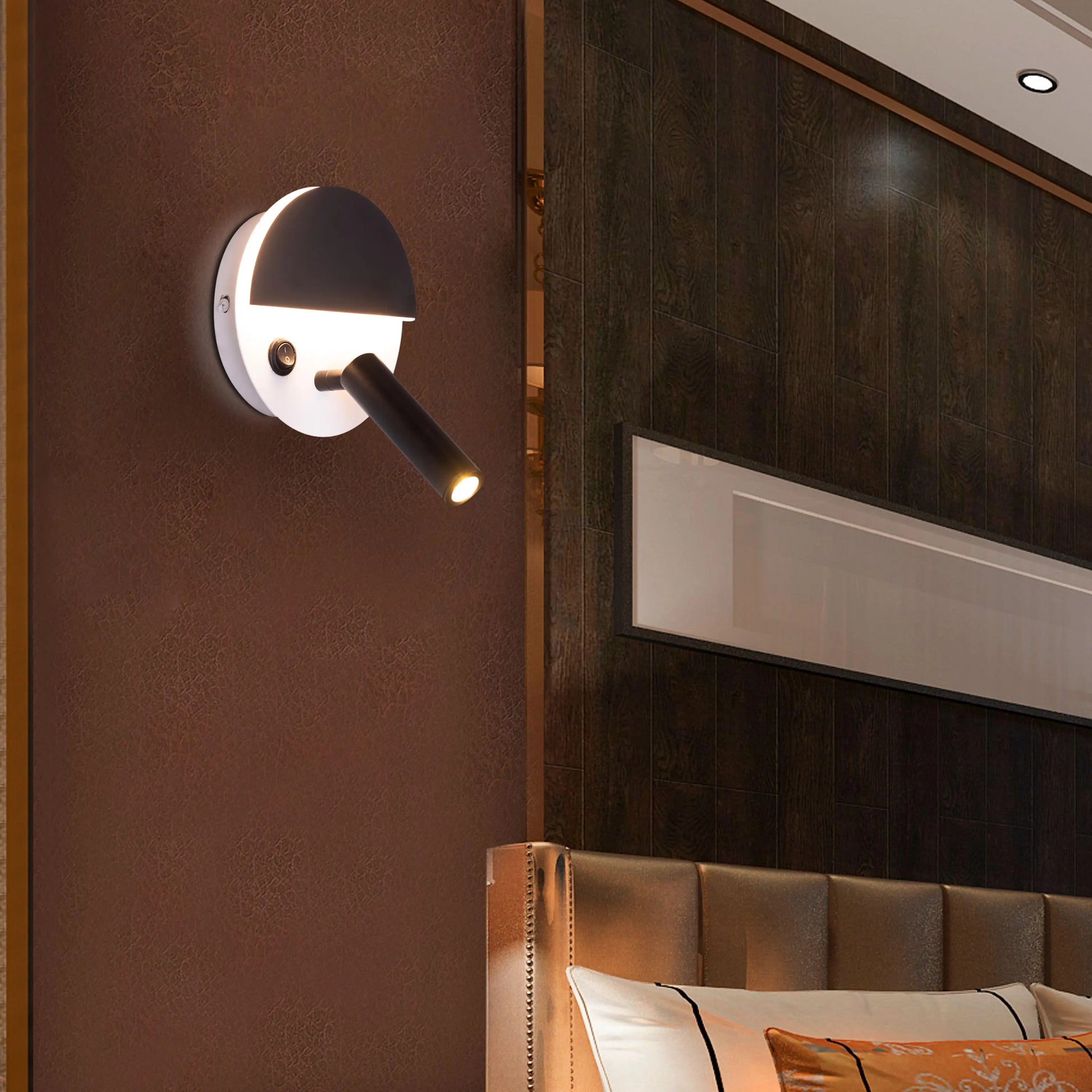 Elegant Elated Wall Light featuring a geometric layered design in brushed metal finish, projecting warm ambient light through crystal-clear glass elements against a neutral wall