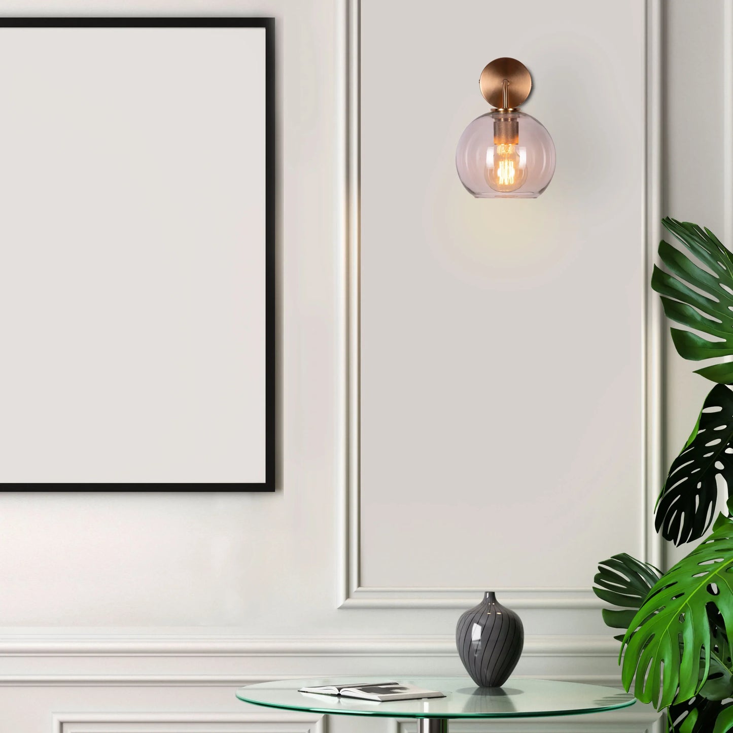Endgame Clear Glass Wall Light - Minimalist and refined wall lighting fixture featuring a clear glass cylinder that houses the integrated LED light source, accentuated by a sleek metal housing.