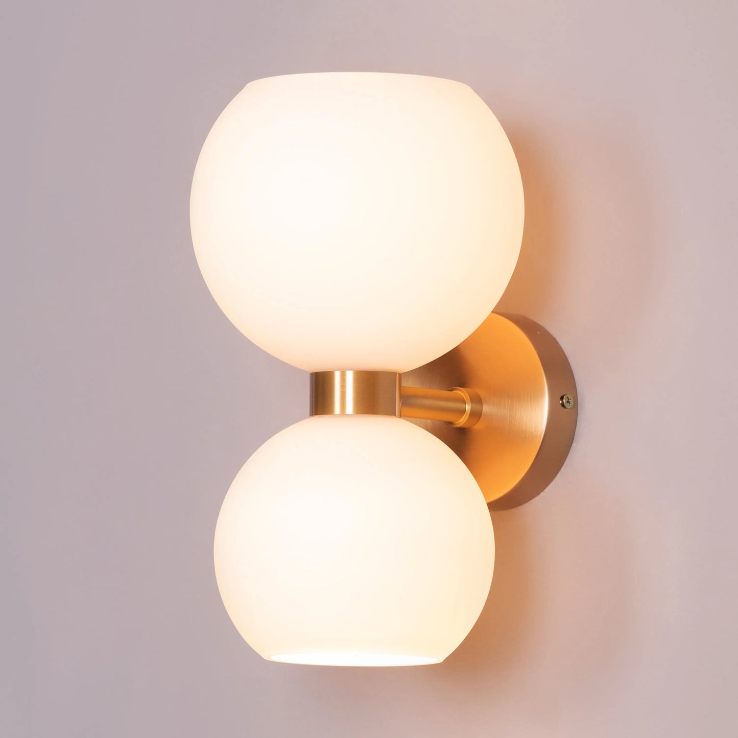 Afloat Wall Light - Captivating wall lighting fixture with a minimalist metal frame that appears to float effortlessly, supporting a soft, hazy glass diffuser that emits a warm and tranquil glow.
