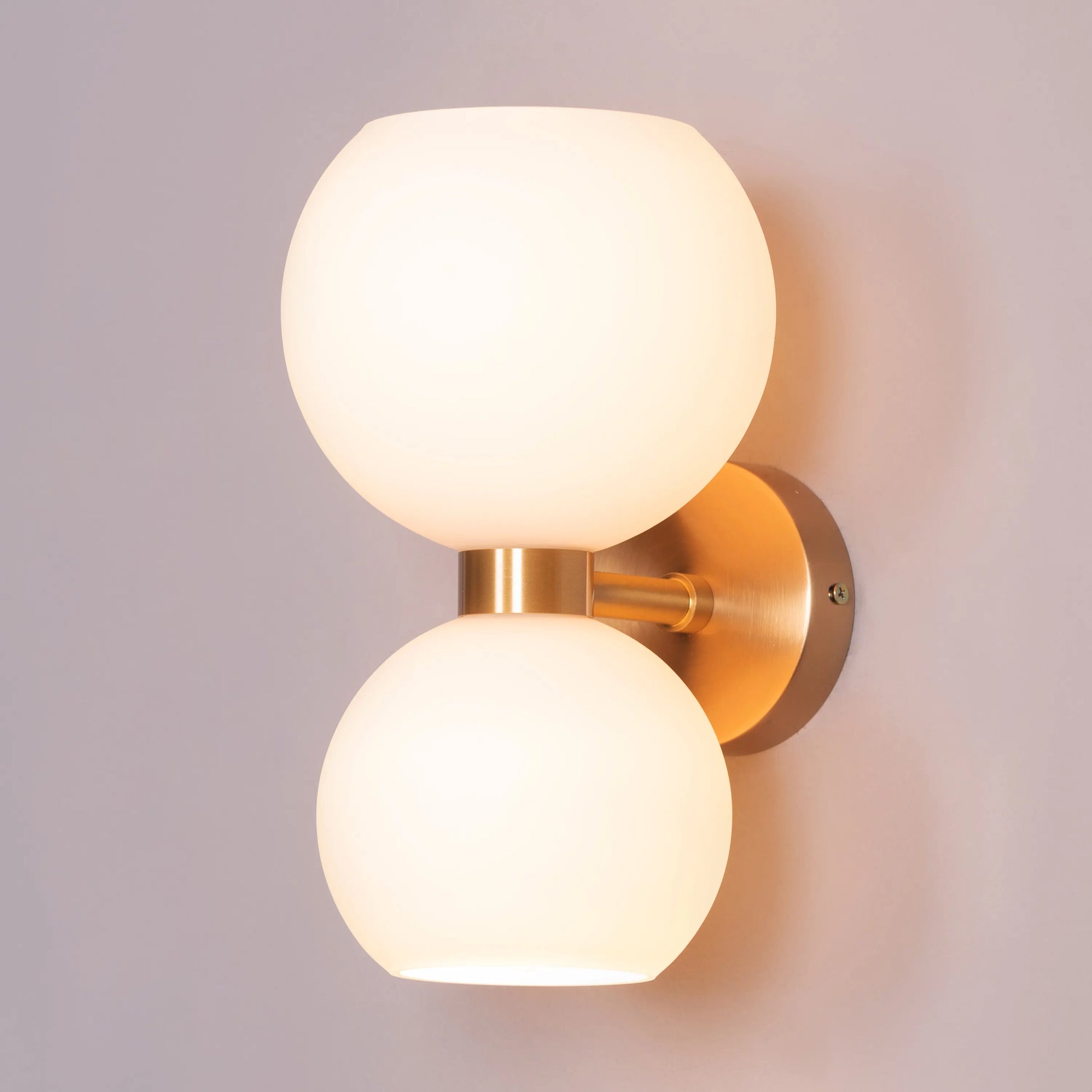 Afloat Wall Light - Captivating wall lighting fixture with a minimalist metal frame that appears to float effortlessly, supporting a soft, hazy glass diffuser that emits a warm and tranquil glow.