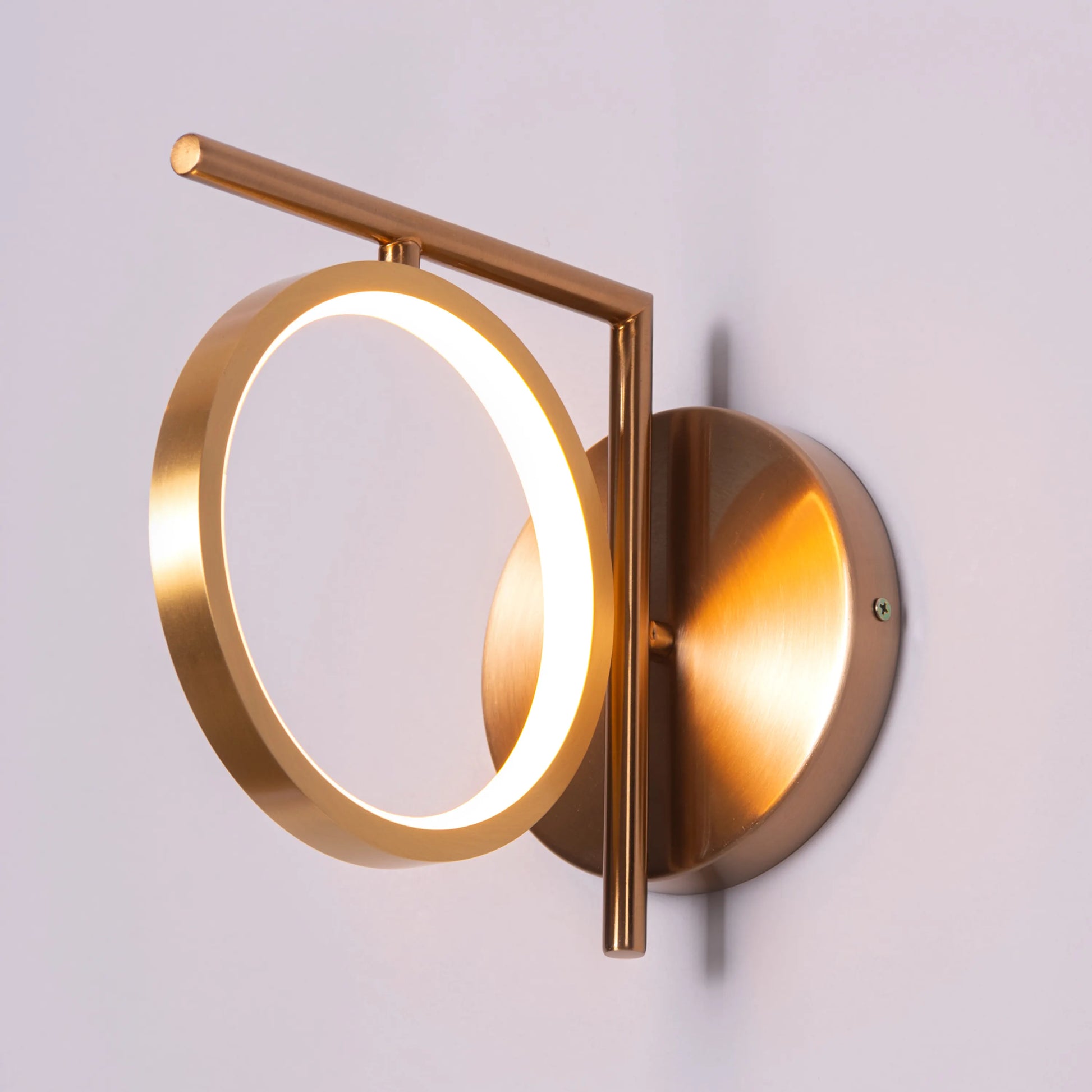 Taste of Honey Wall Light - Warm and inviting wall lighting fixture featuring a subtly curved glass diffuser that emits a soft, honey-colored glow, accentuated by a sleek metal housing.