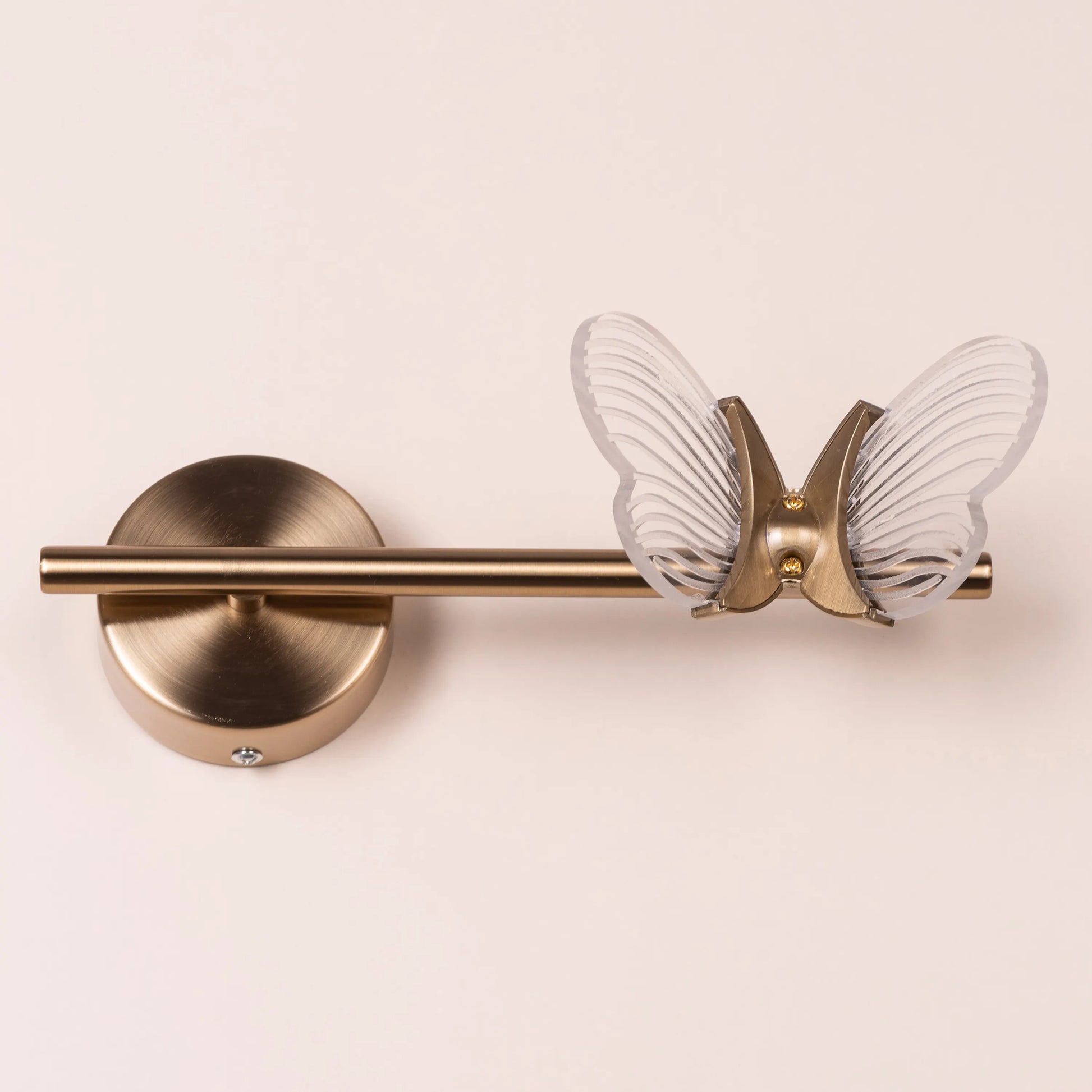 Butterfly Kisses Wall Light - Delicate and enchanting wall lighting fixture featuring a cluster of elegant metal cutouts that form the wings of a butterfly, creating a mesmerizing play of light and shadow.