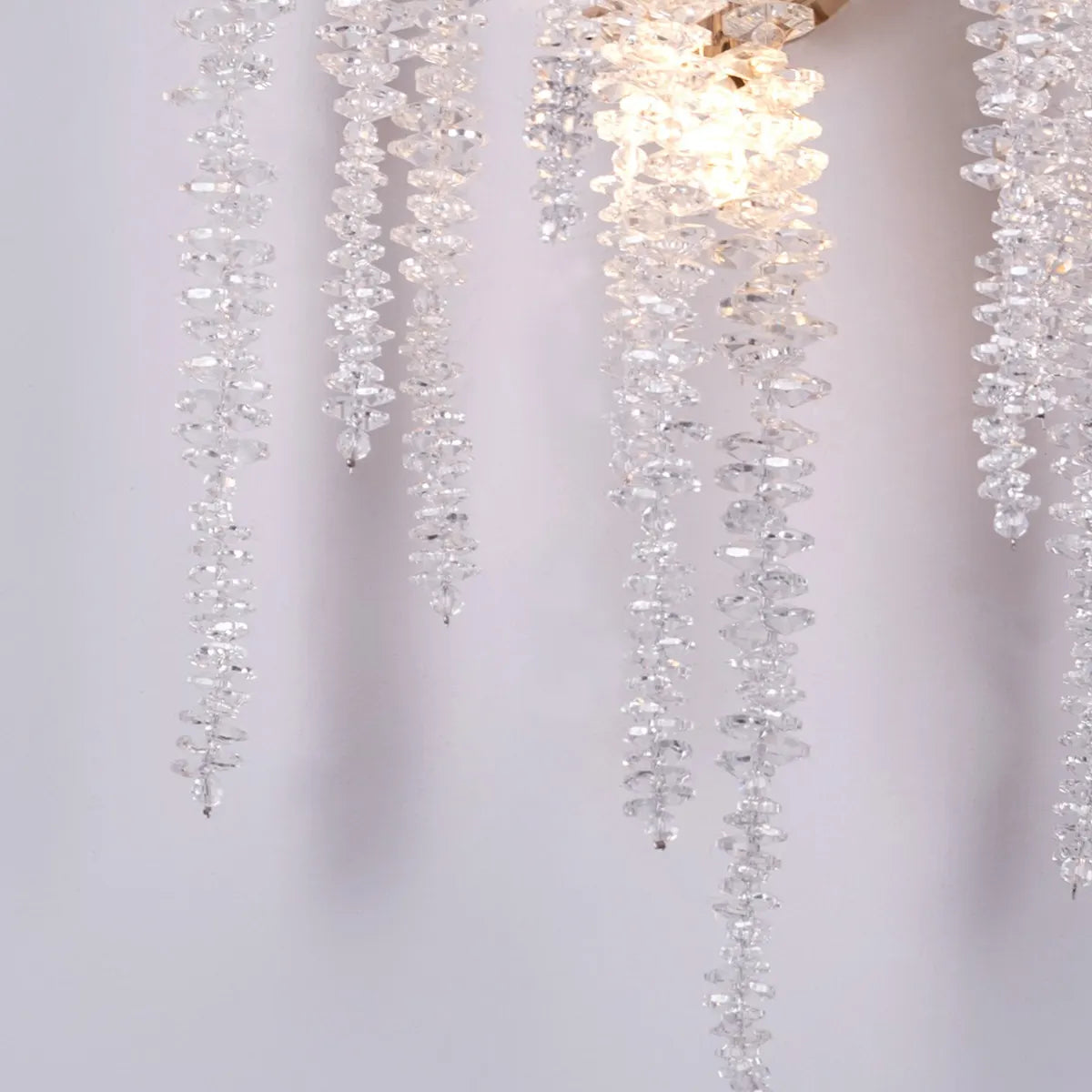 Up with the Fairies Crystal Wall Light - Enchanting and whimsical wall lighting fixture featuring a cluster of beautifully faceted crystal elements suspended within a sleek metal frame, creating a mesmerizing play of light and shadow.