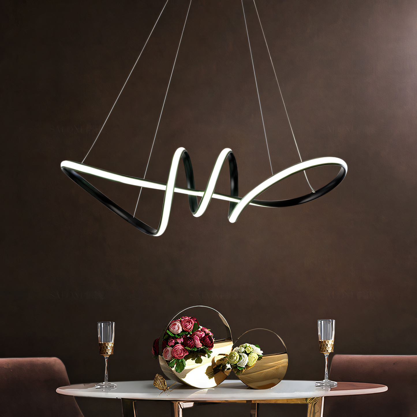 Elegant 700mm wide black metal and LED light chandelier with a clean, futuristic aesthetic, illuminating an upscale dining space