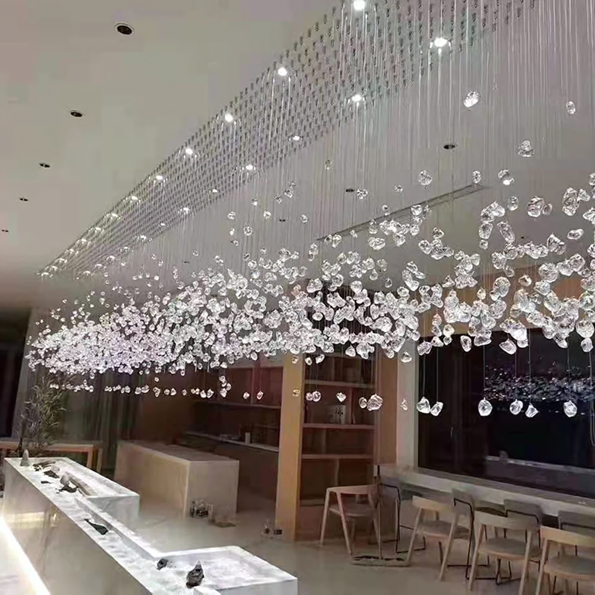 Hundreds of sparkling crystal drops on the Falling Star Chandelier